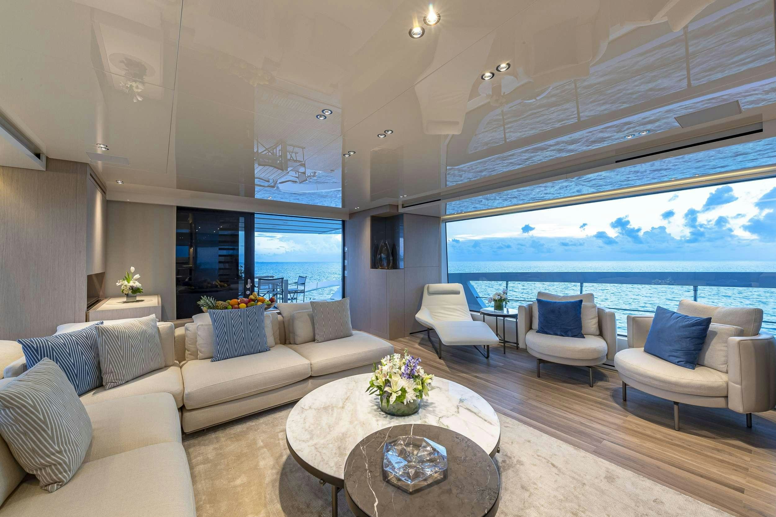 a living room with a large window aboard NO MATTER WHAT Yacht for Charter