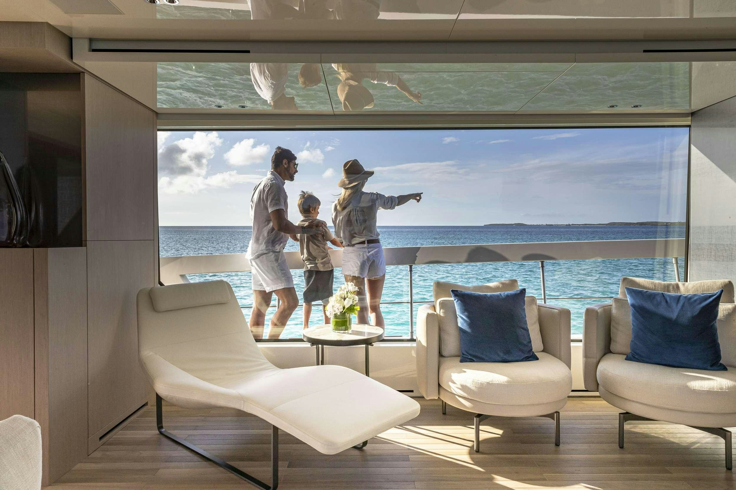 a family standing on a balcony aboard NO MATTER WHAT Yacht for Charter