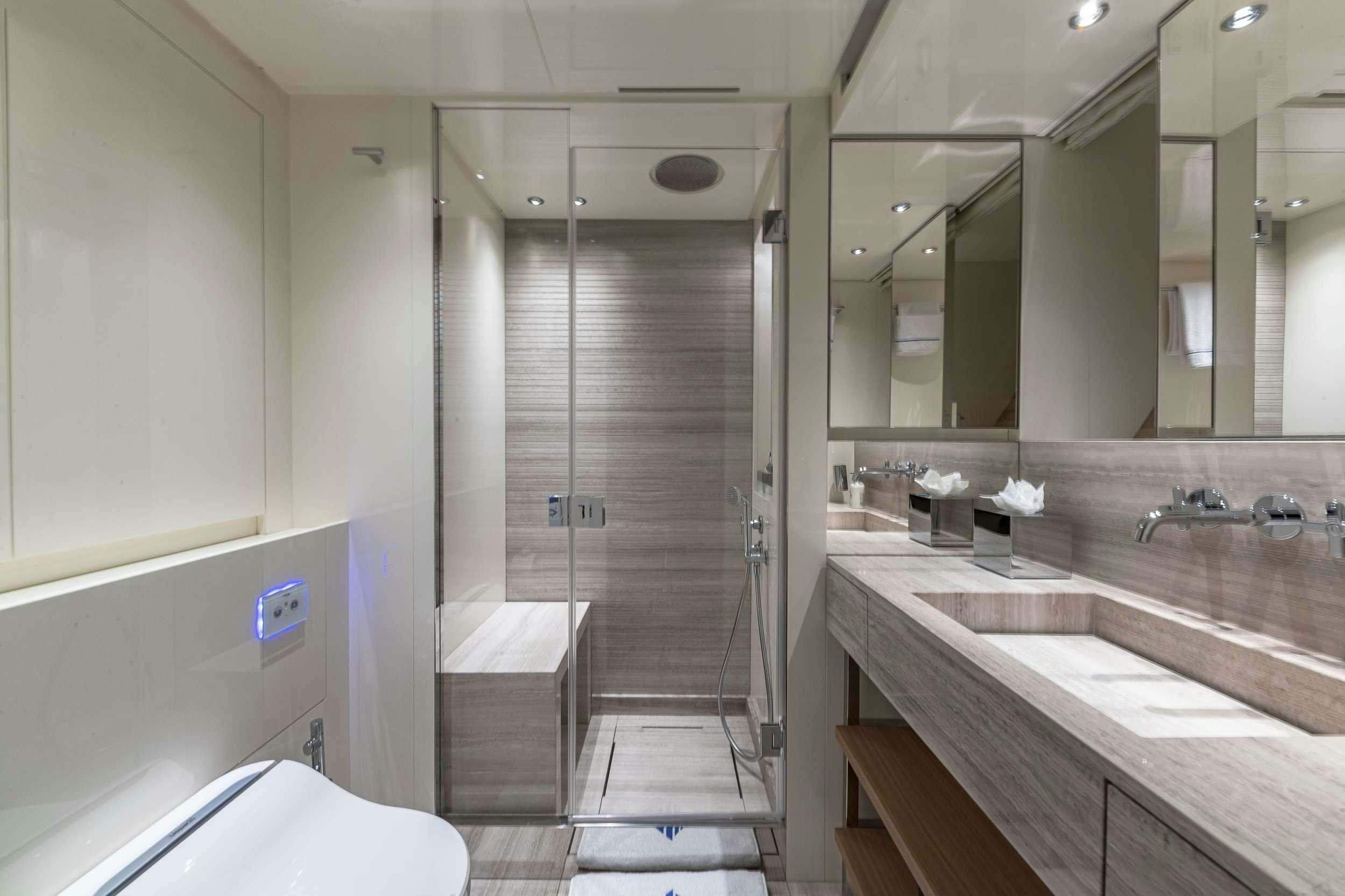 a bathroom with a standup shower aboard NO MATTER WHAT Yacht for Charter