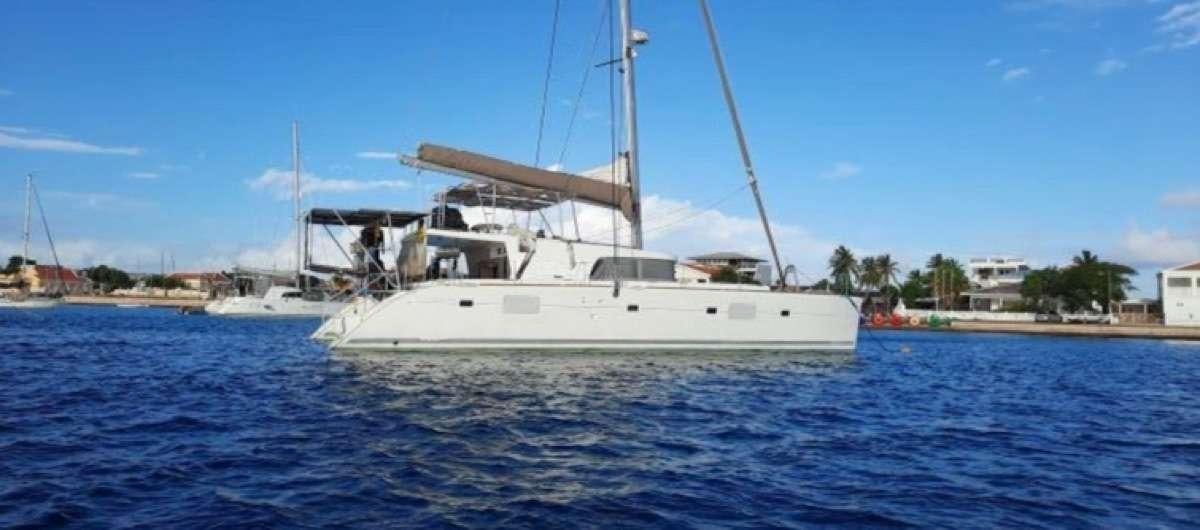 a white boat in the water aboard Sea U Later Yacht for Charter