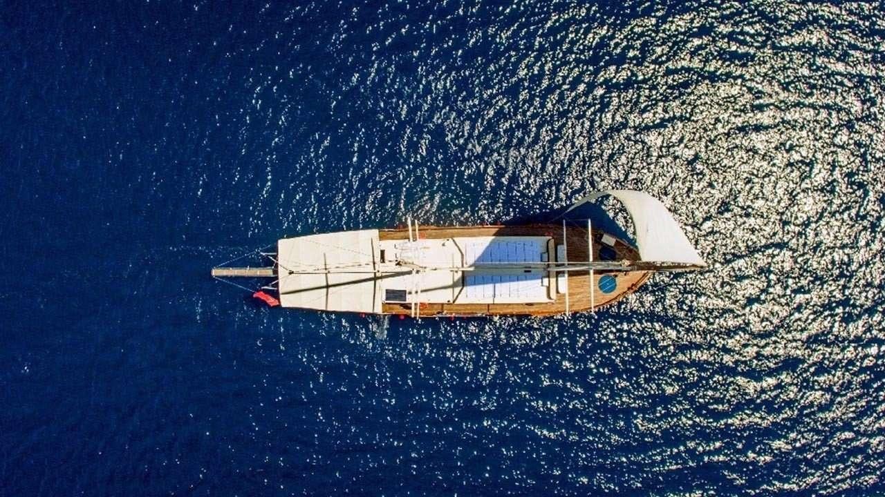 a small boat in the water aboard AMETIST A Yacht for Charter