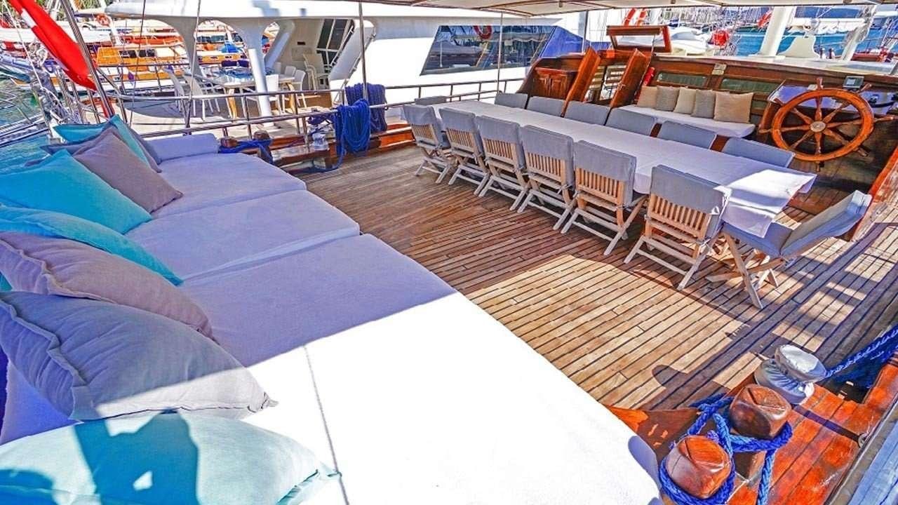 a room with chairs and tables aboard AMETIST A Yacht for Charter