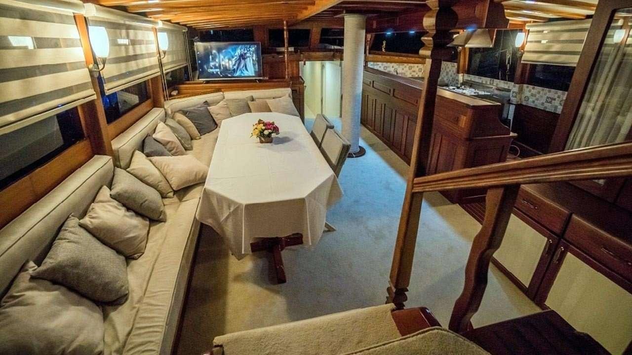 a room with a couch and a table aboard AMETIST A Yacht for Charter