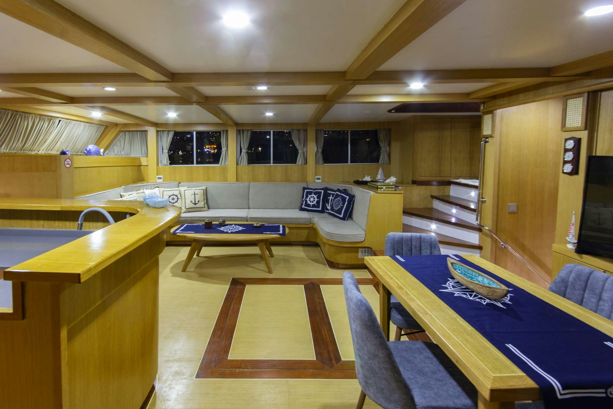 a room with a table and chairs aboard MARE D ELFIDA Yacht for Charter