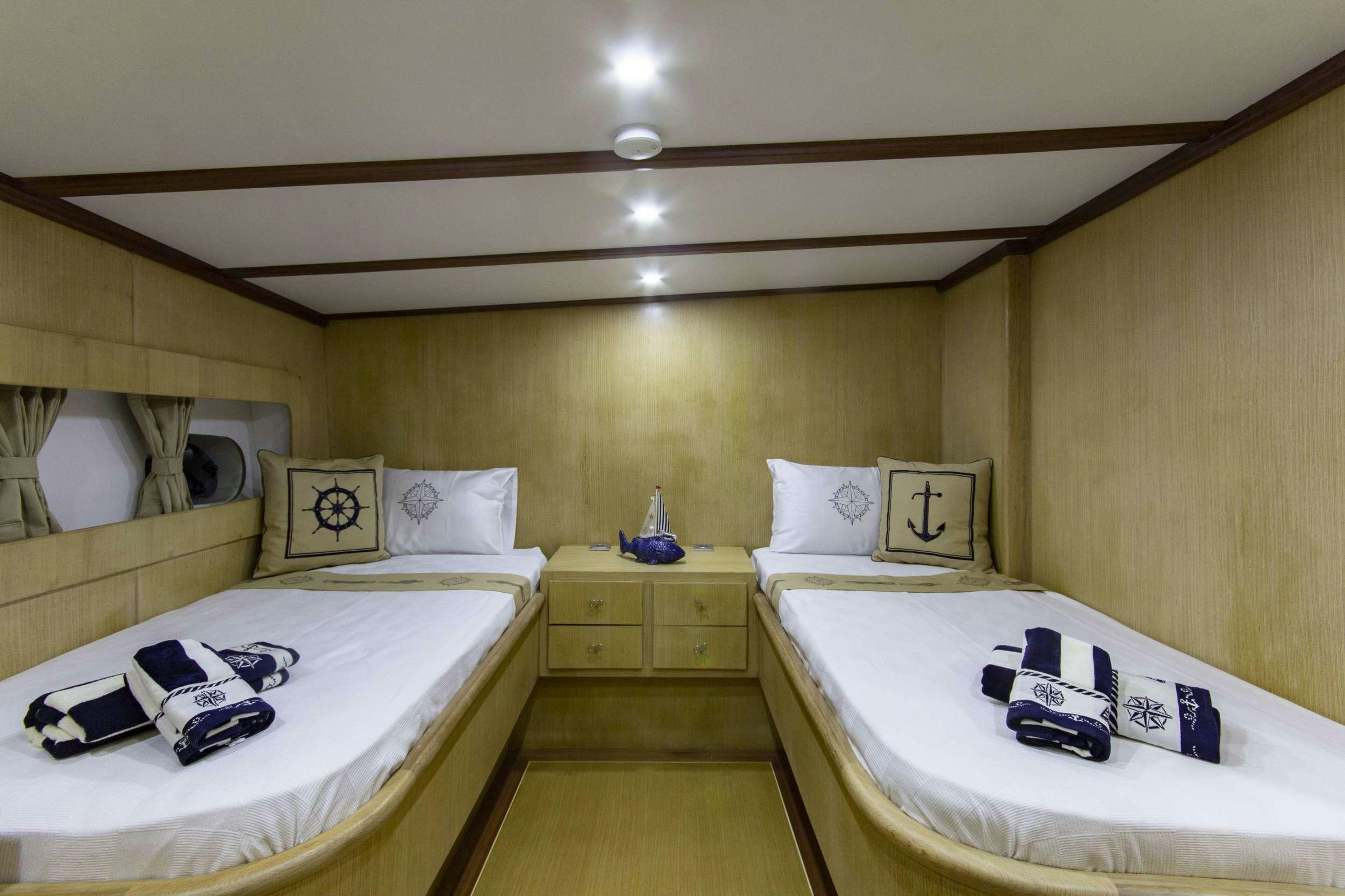 a room with two beds aboard MARE D ELFIDA Yacht for Charter