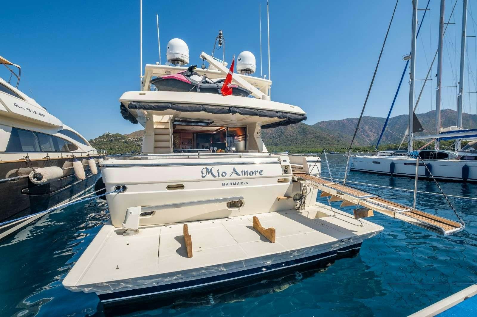 a group of boats are parked in a harbor aboard MIO AMORE Yacht for Charter