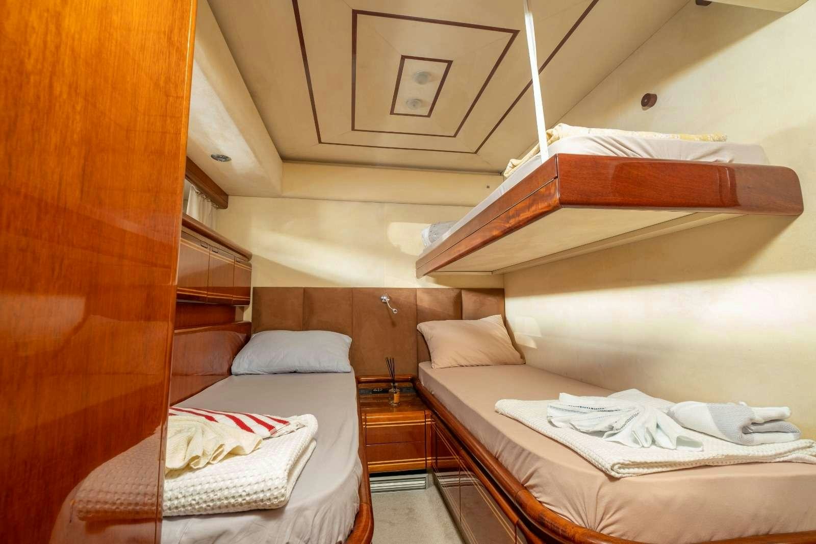 a room with two beds aboard MIO AMORE Yacht for Charter