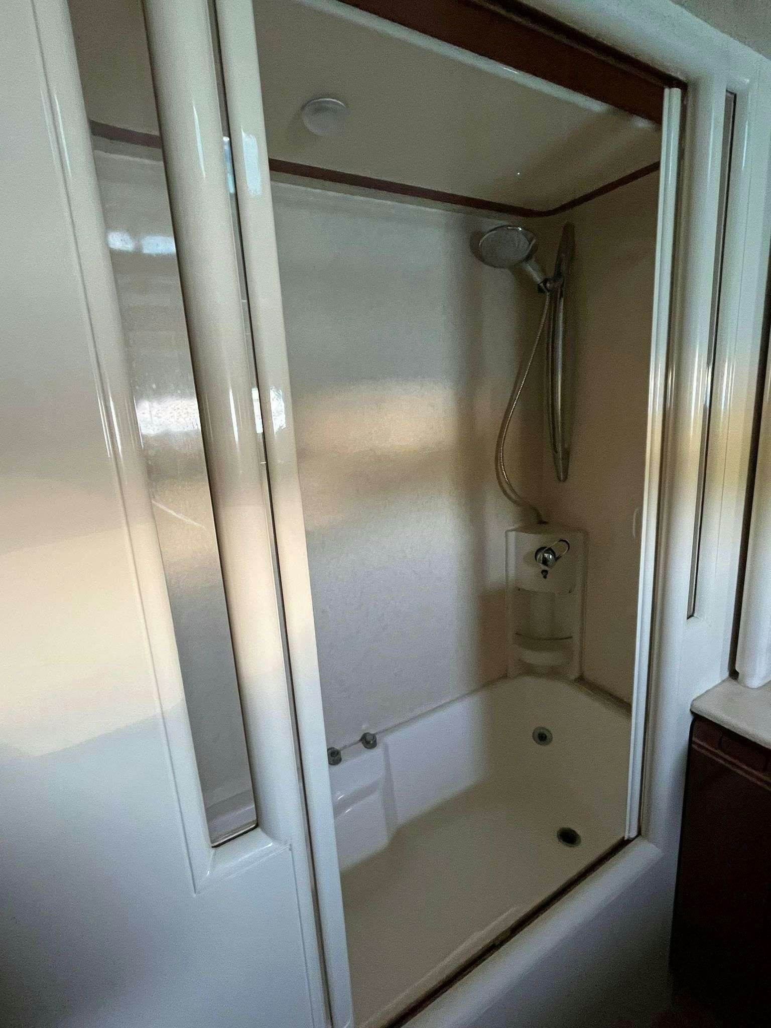 a shower with a glass door aboard MIO AMORE Yacht for Charter