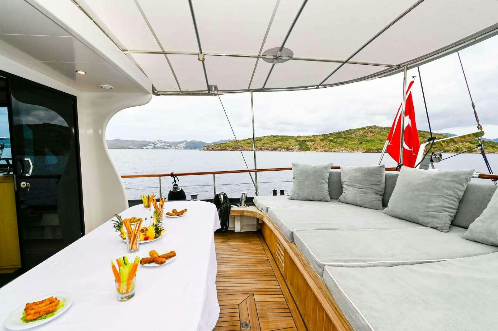 a room with a table and a bed aboard ESER 1 Yacht for Charter