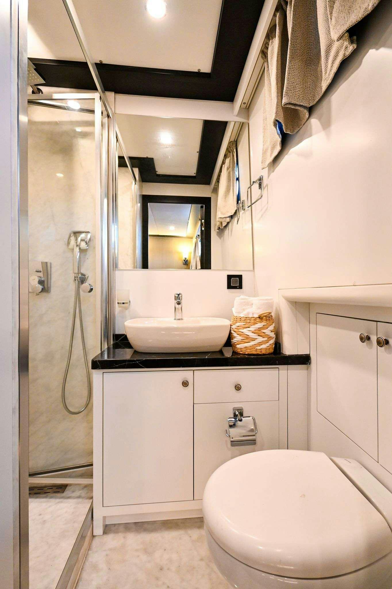 a bathroom with a sink and toilet aboard ESER 1 Yacht for Charter
