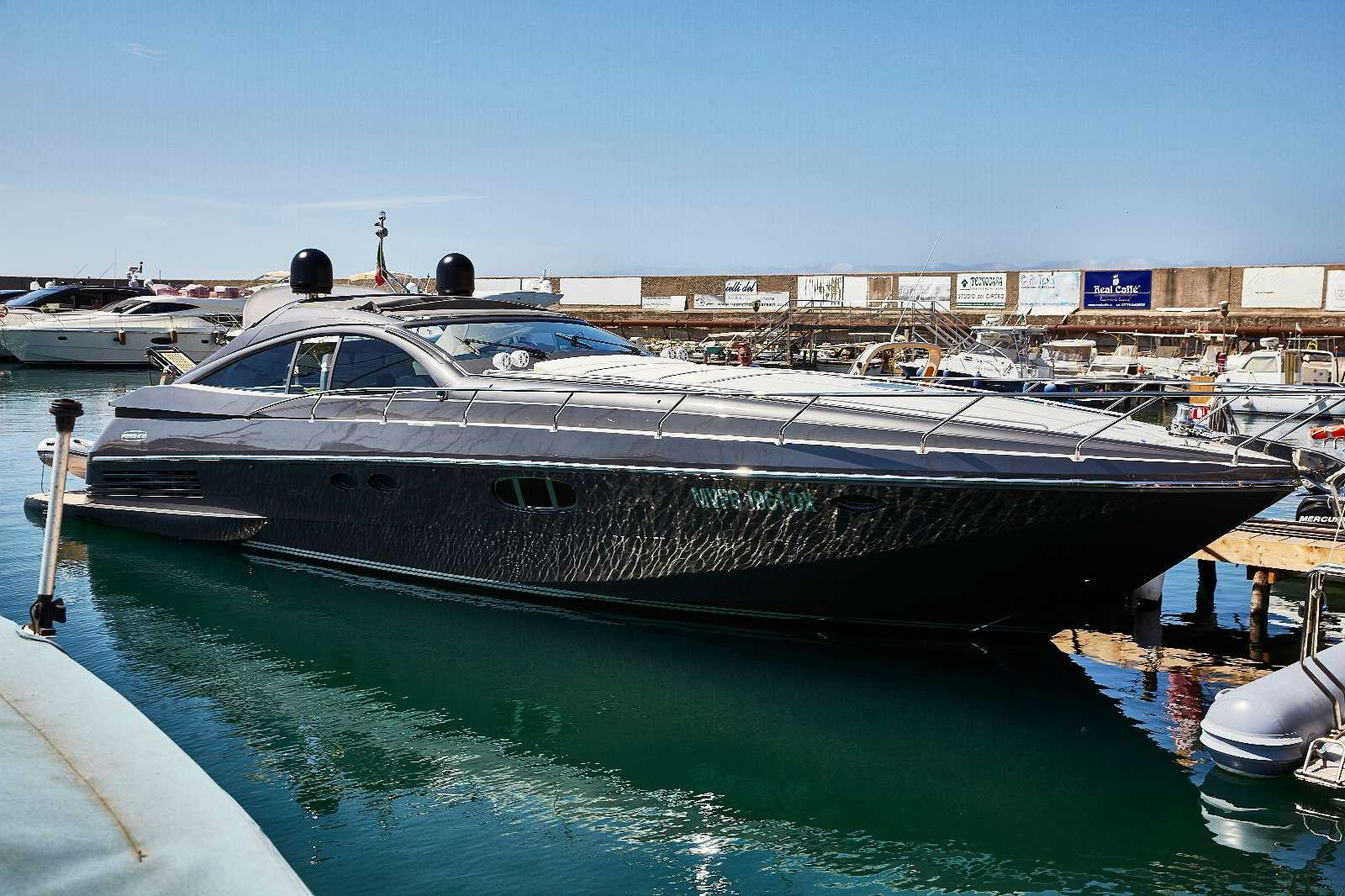 a boat docked at a pier aboard SOPHIA Yacht for Charter