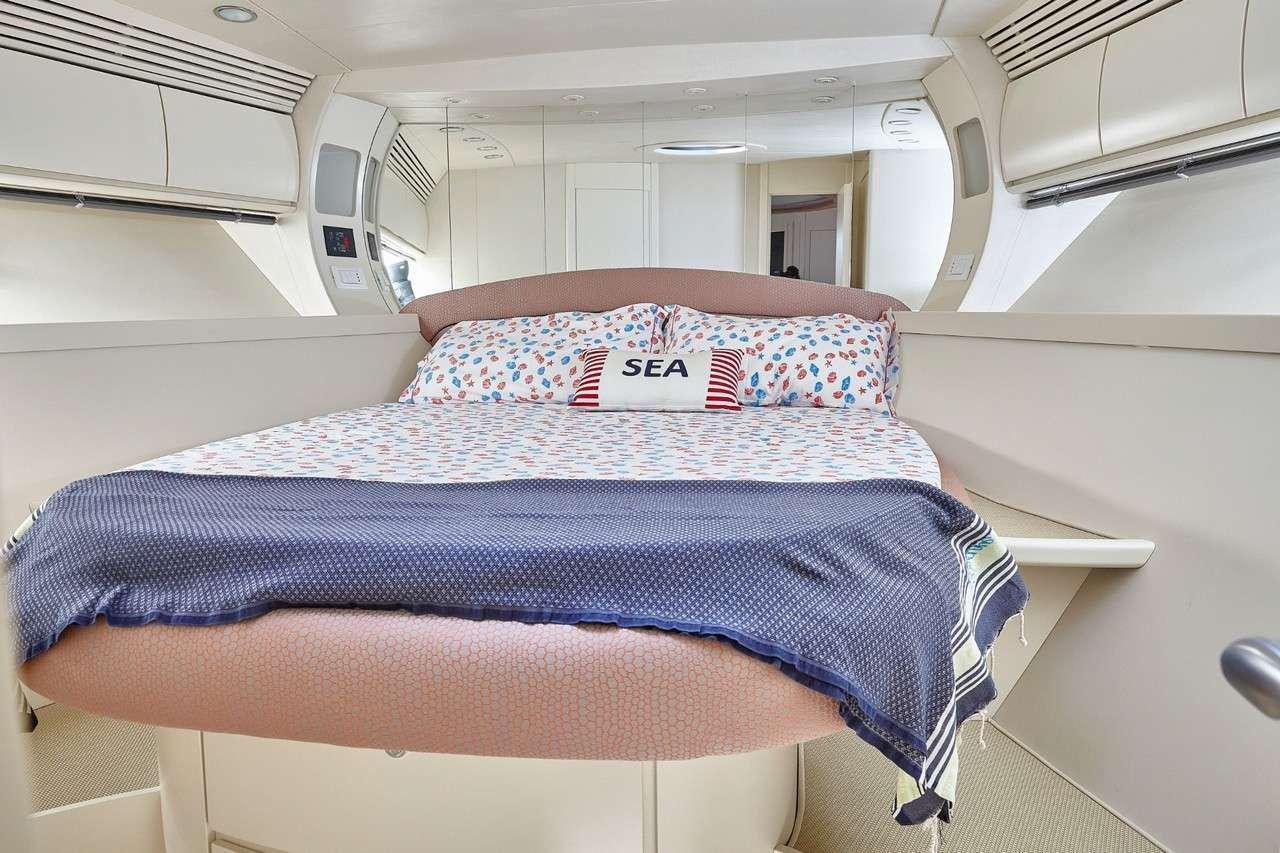 a bed in a room aboard SOPHIA Yacht for Charter