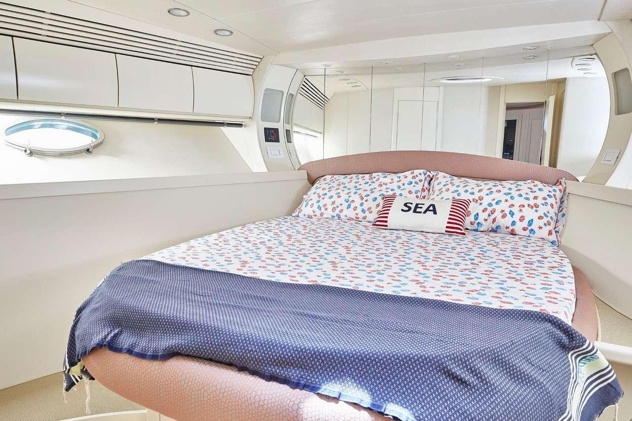 a person lying in a bed aboard SOPHIA Yacht for Charter