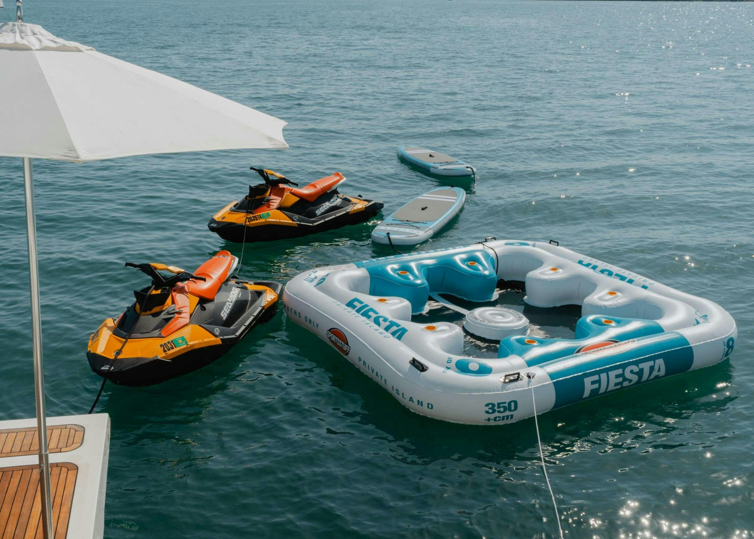 a couple of boats in the water aboard BONUS ROUND Yacht for Charter