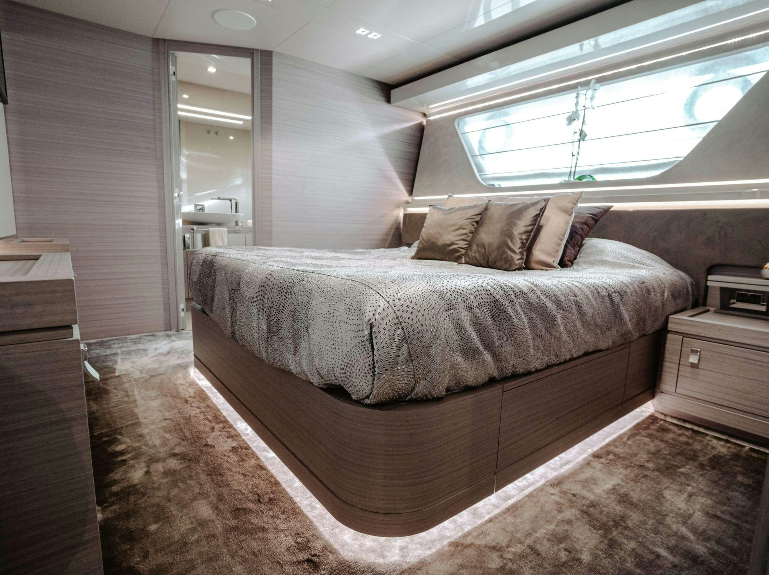 a bed in a room aboard BONUS ROUND Yacht for Charter