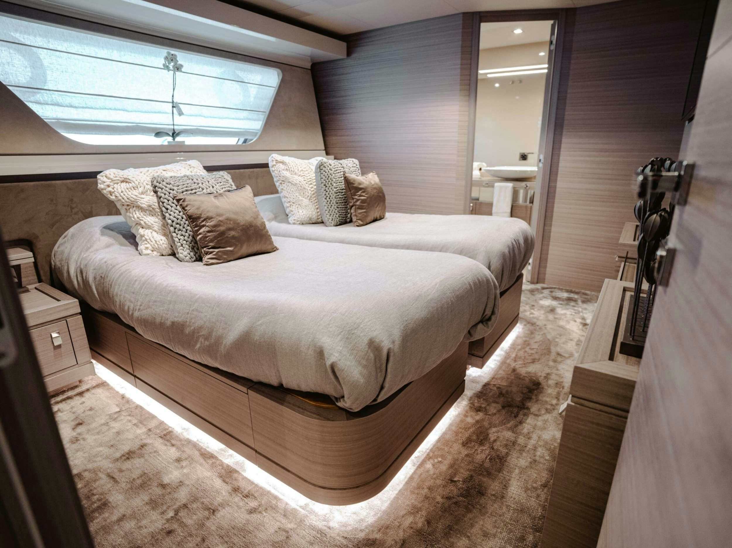 a bed in a room aboard BONUS ROUND Yacht for Charter