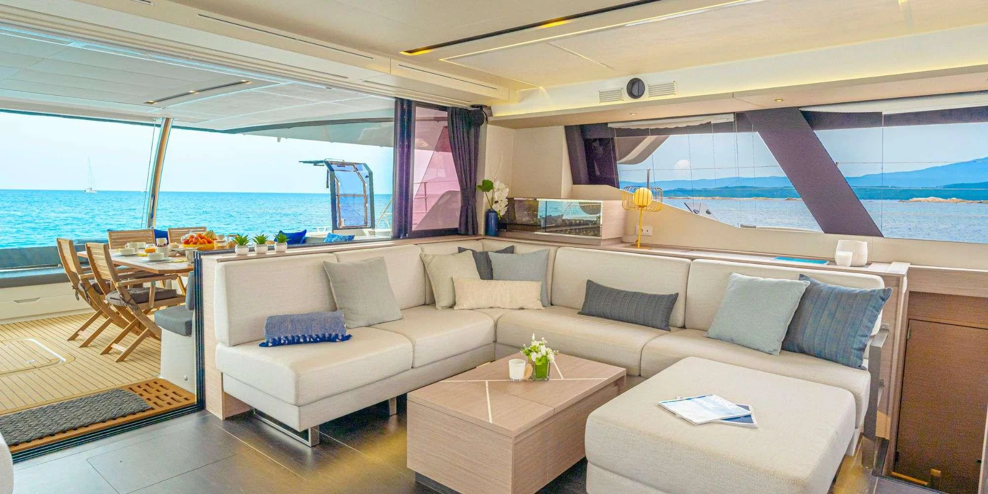 a living room with a large window aboard SEMPER FIDELIS Yacht for Charter