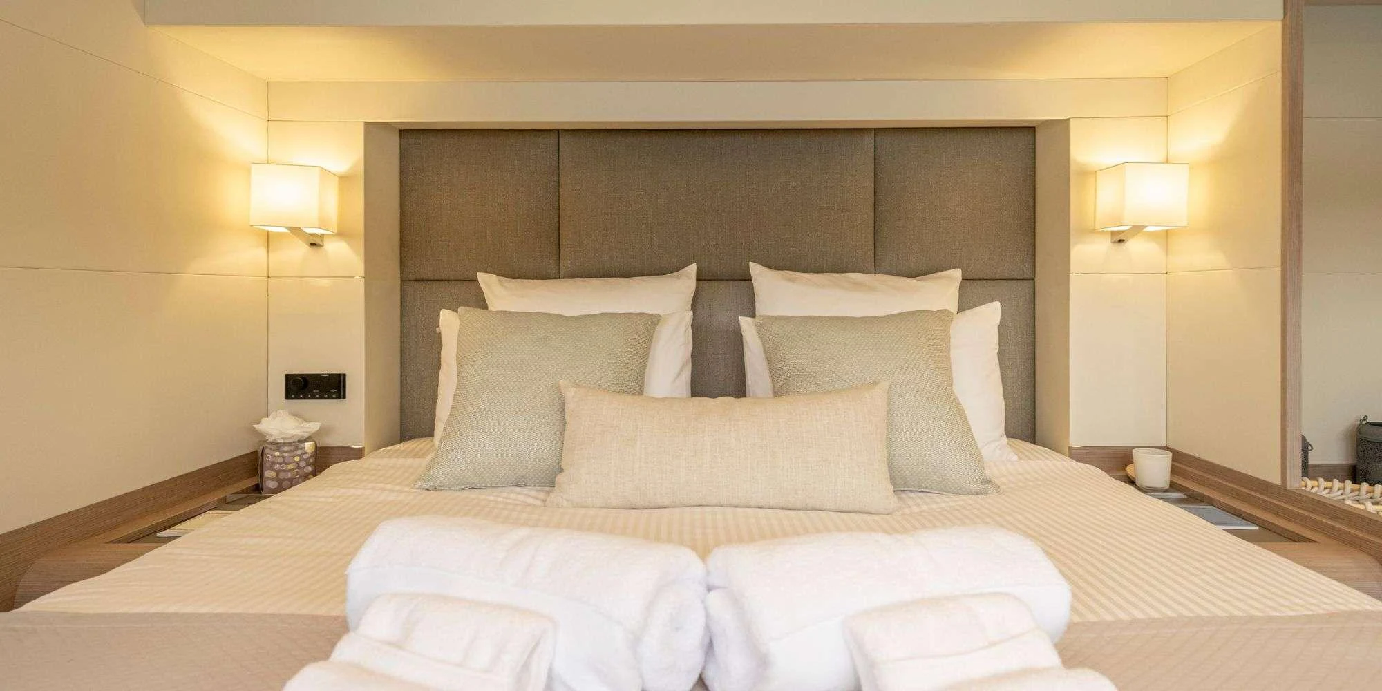 a bed with white pillows aboard SEMPER FIDELIS Yacht for Charter