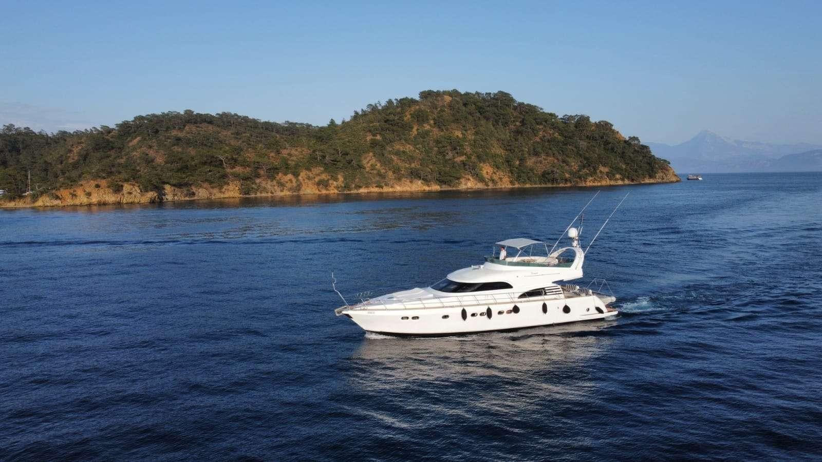 a white boat on the water aboard SIROCCO Yacht for Charter