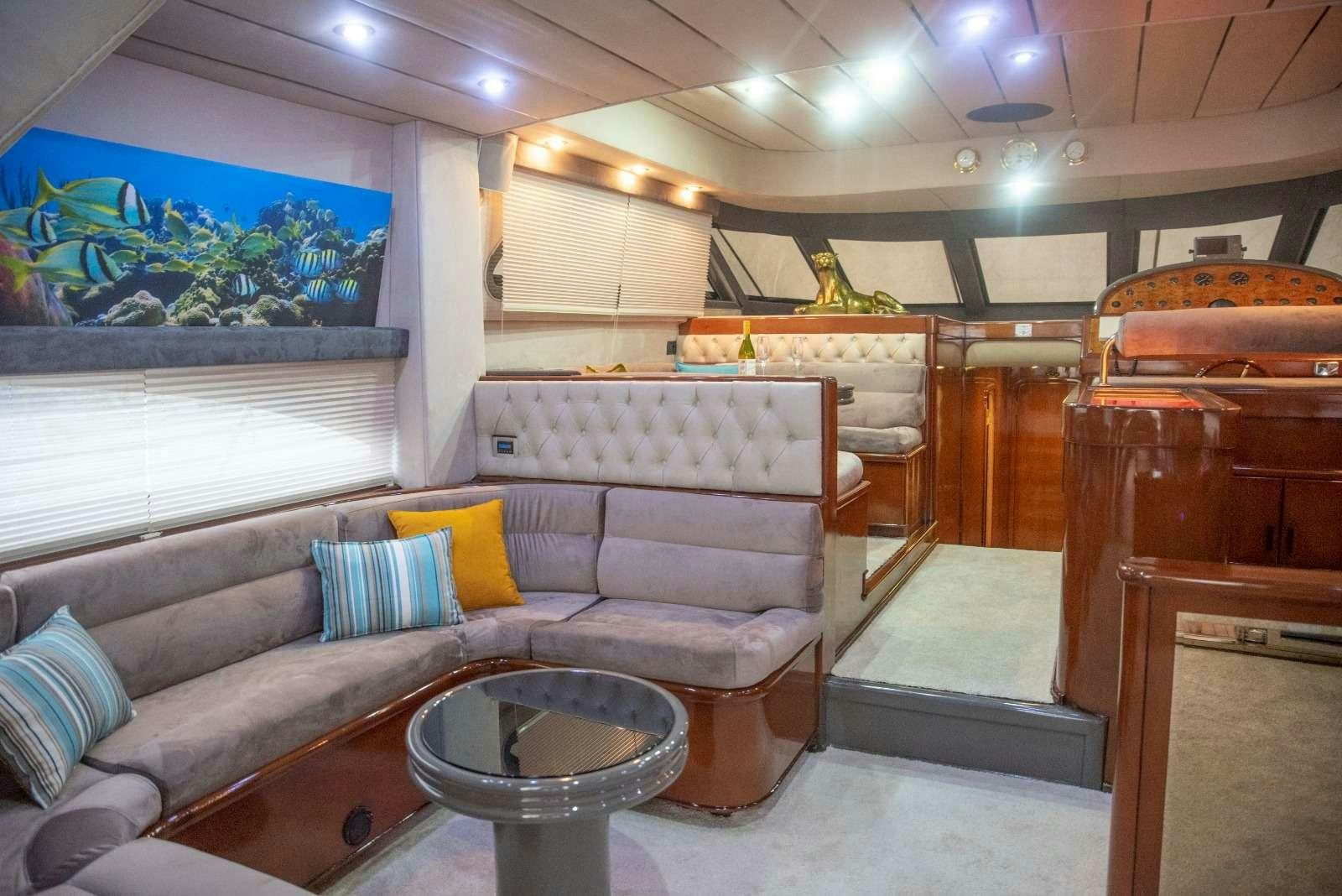 a living room with a couch and a table aboard SIROCCO Yacht for Charter