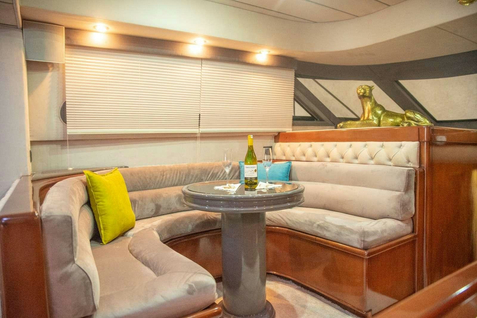 a living room with a couch and a table aboard SIROCCO Yacht for Charter