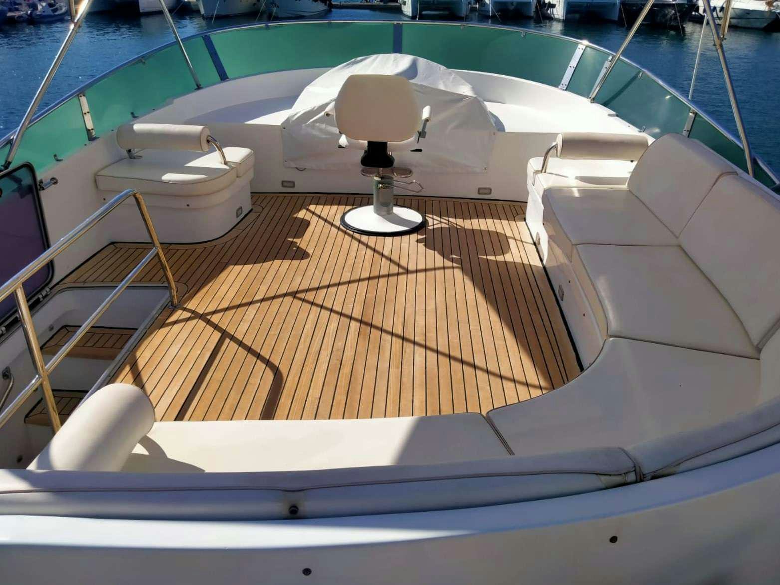 a white lounge chair next to a pool aboard SIROCCO Yacht for Charter