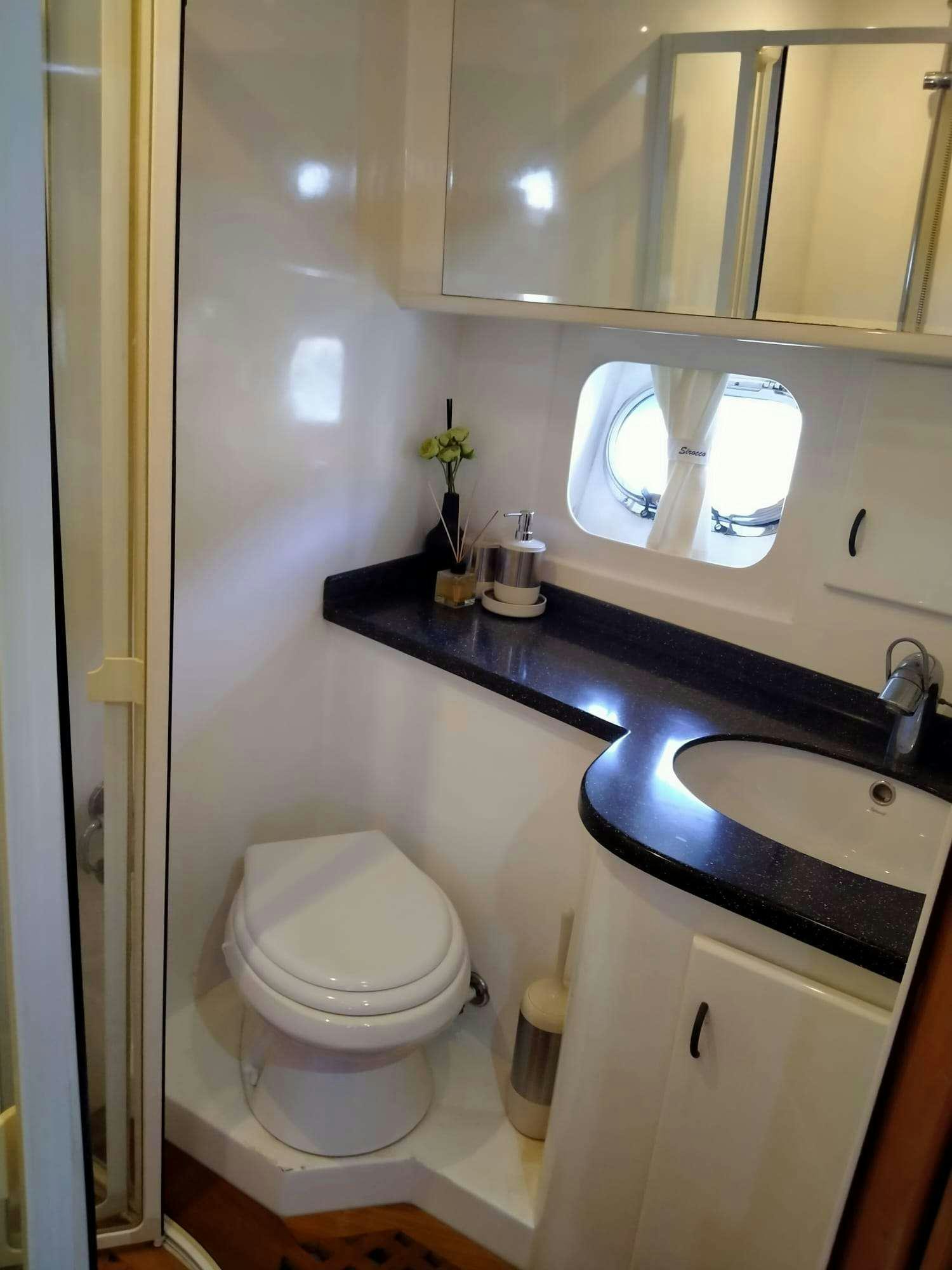 a bathroom with a sink and a toilet aboard SIROCCO Yacht for Charter