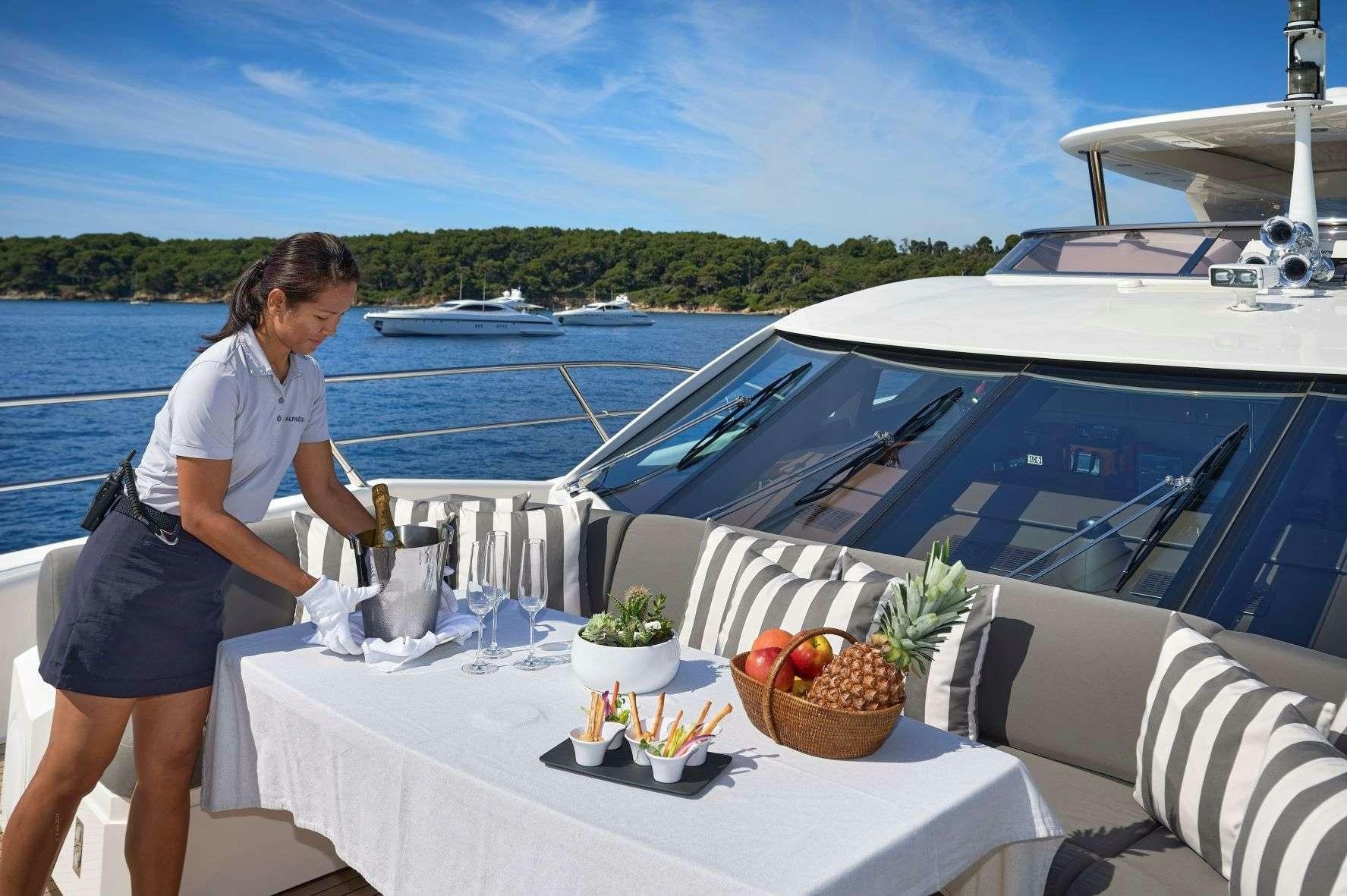 a person standing on a boat aboard EVEREAST Yacht for Charter