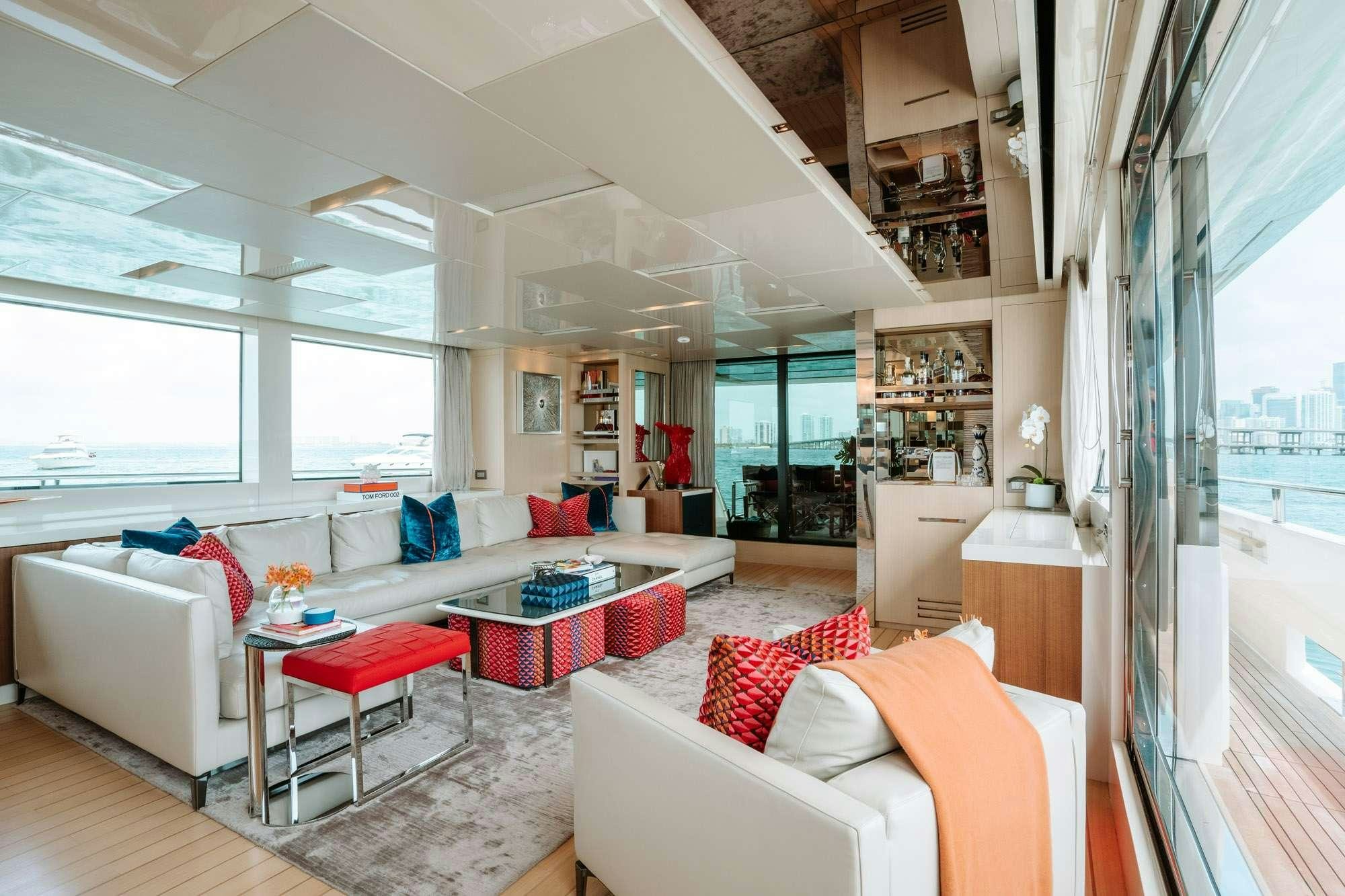 a living room with a large window aboard FIFTY SHADES Yacht for Charter