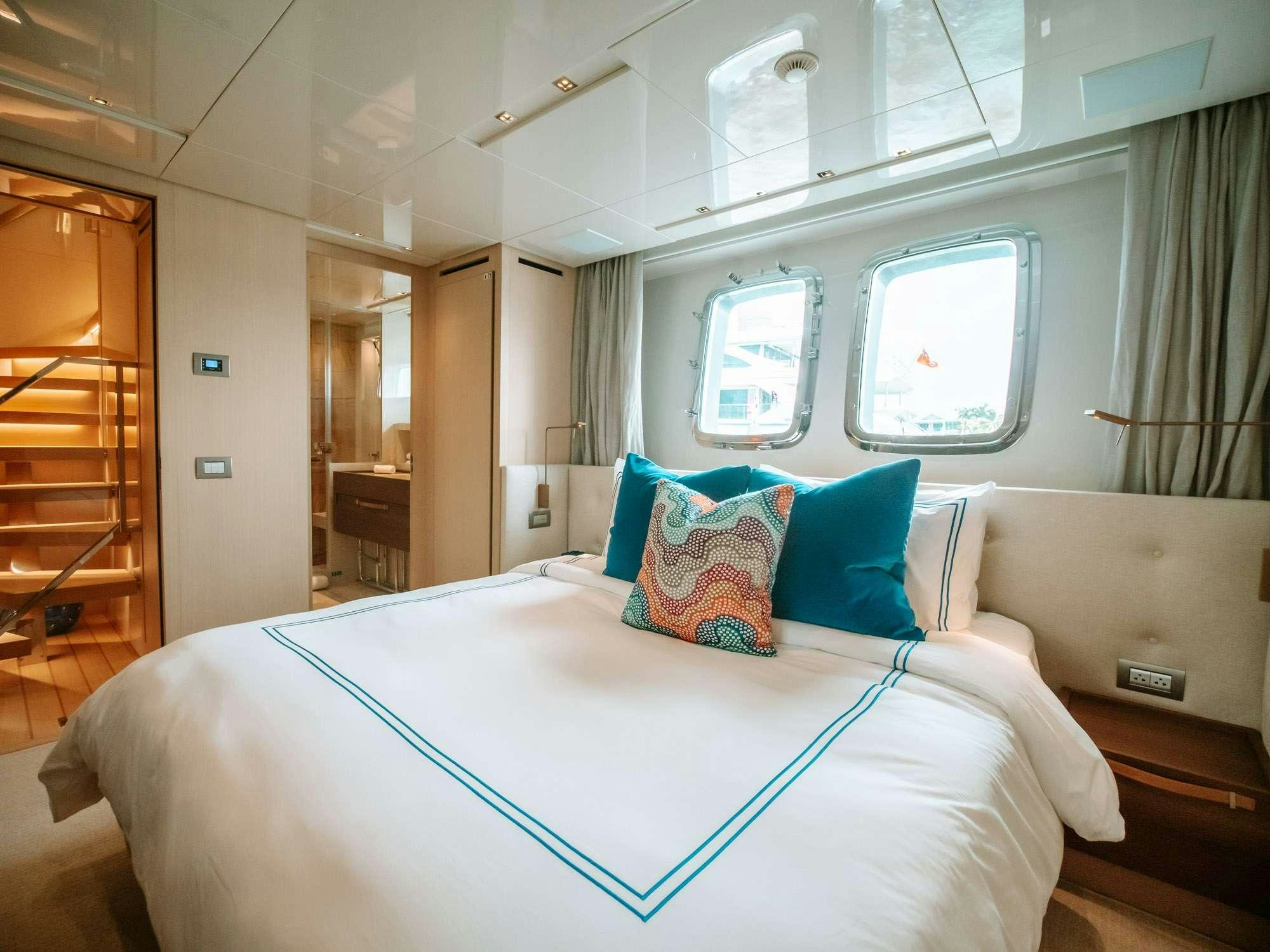 a bed in a room aboard FIFTY SHADES Yacht for Charter