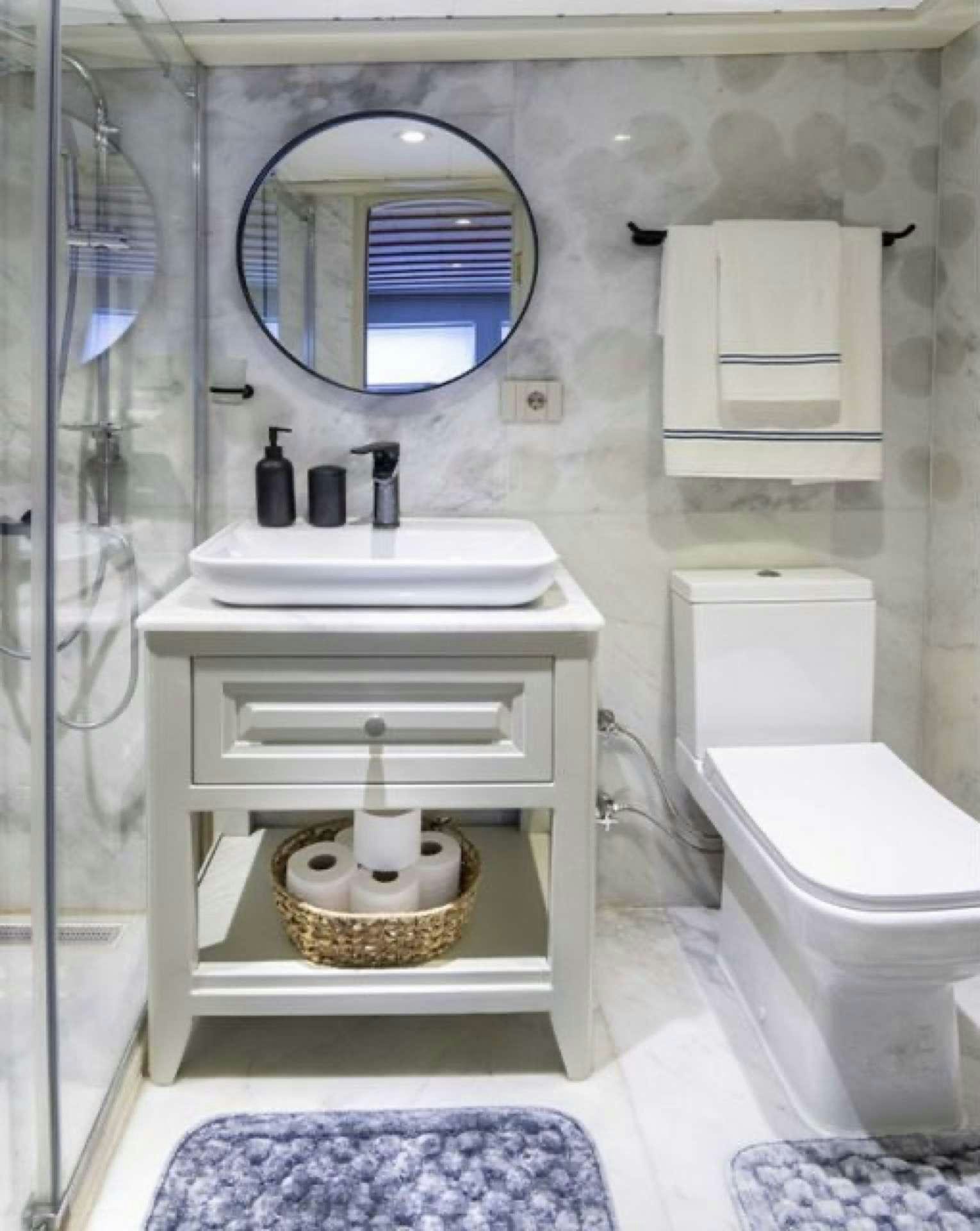 a bathroom with a sink and toilet aboard CAUSTIC Yacht for Charter