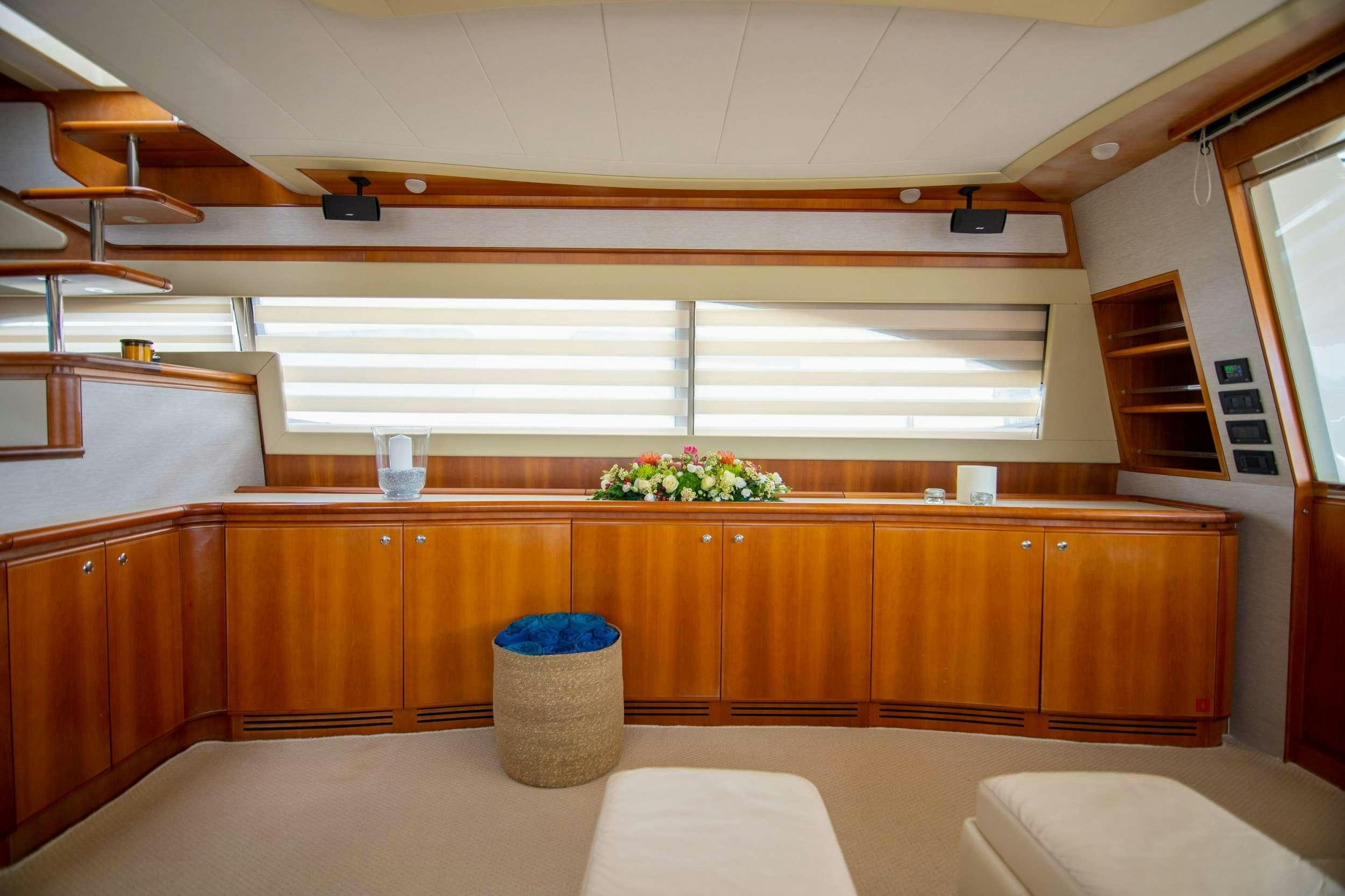 a kitchen with wooden cabinets aboard SOFIA D Yacht for Charter