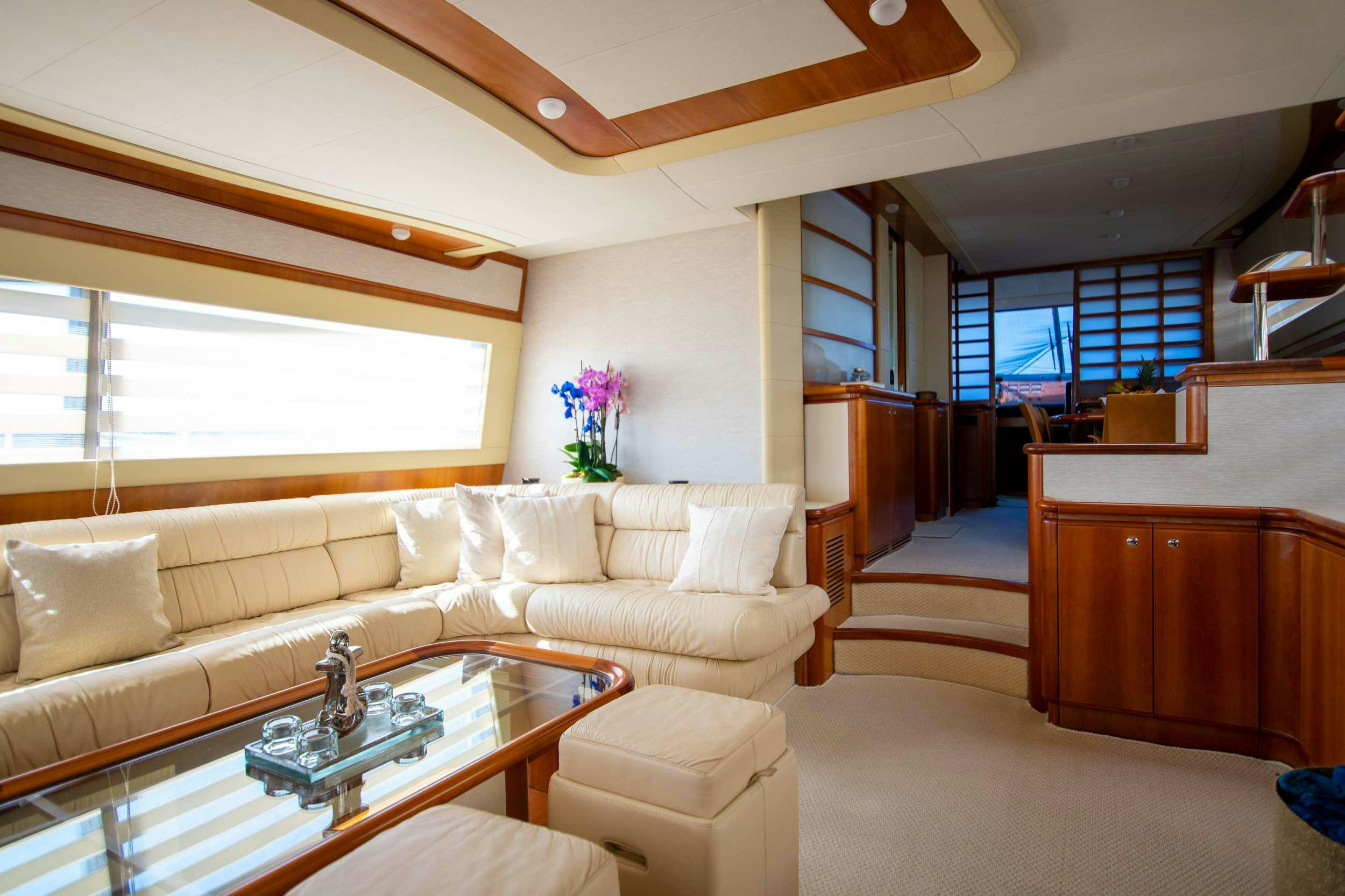 a living room with a large window aboard SOFIA D Yacht for Charter