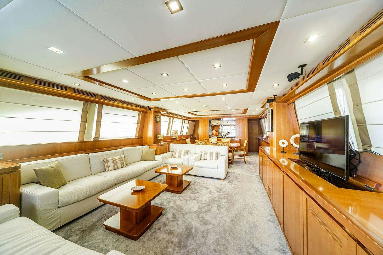 a living room with a large television aboard SANREF Yacht for Charter