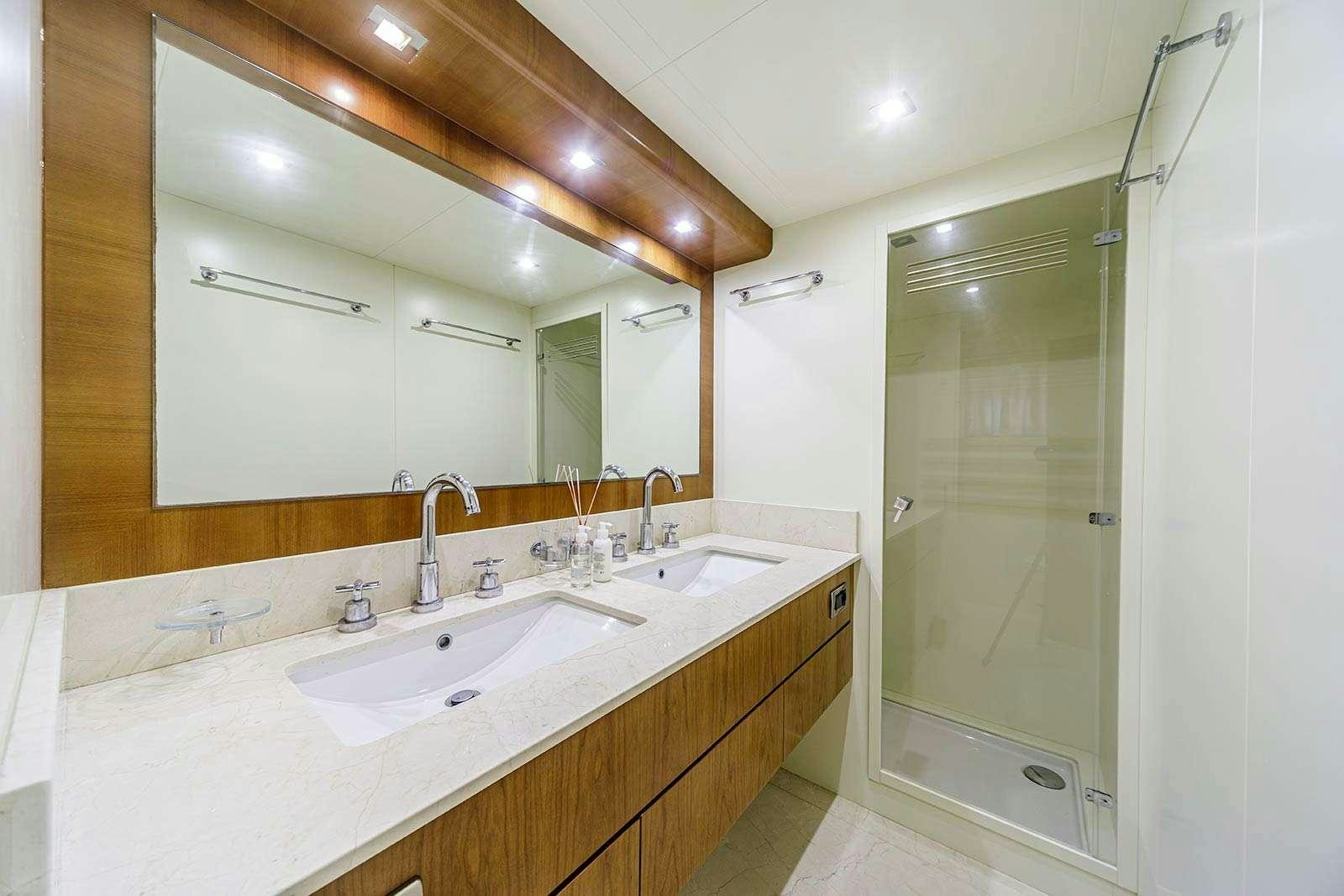 a bathroom with a large mirror aboard SANREF Yacht for Charter