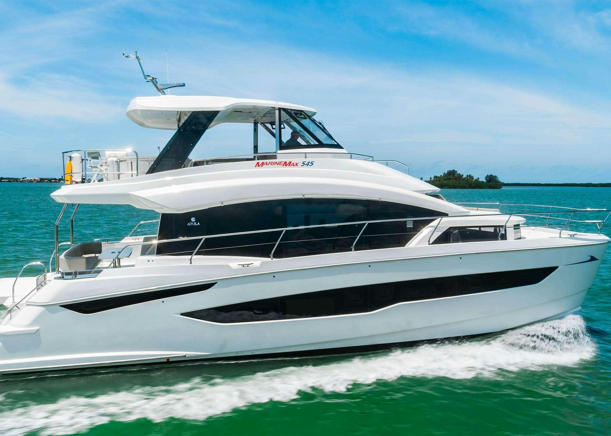 a white yacht on the water aboard GO TEAM Yacht for Charter
