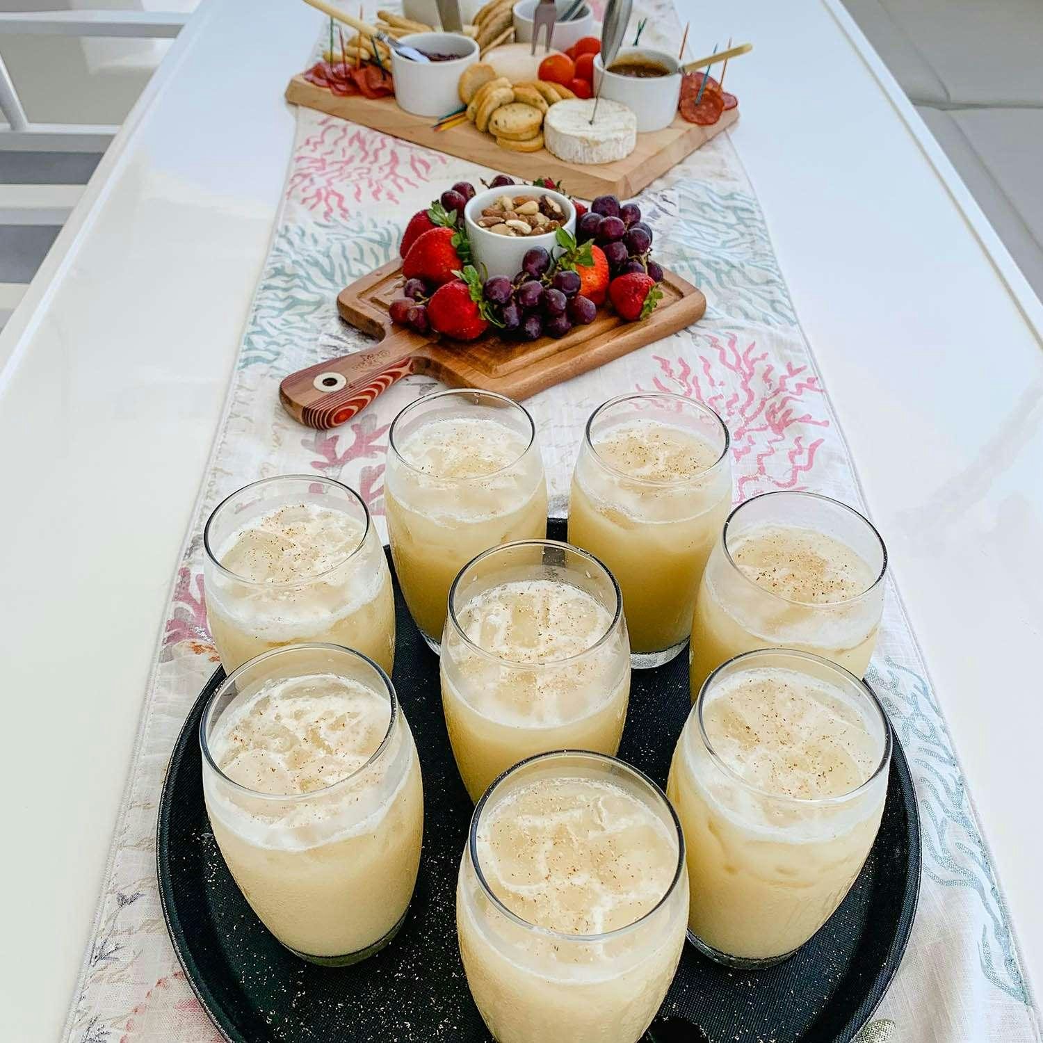 a table with food and drinks on it aboard GO TEAM Yacht for Charter
