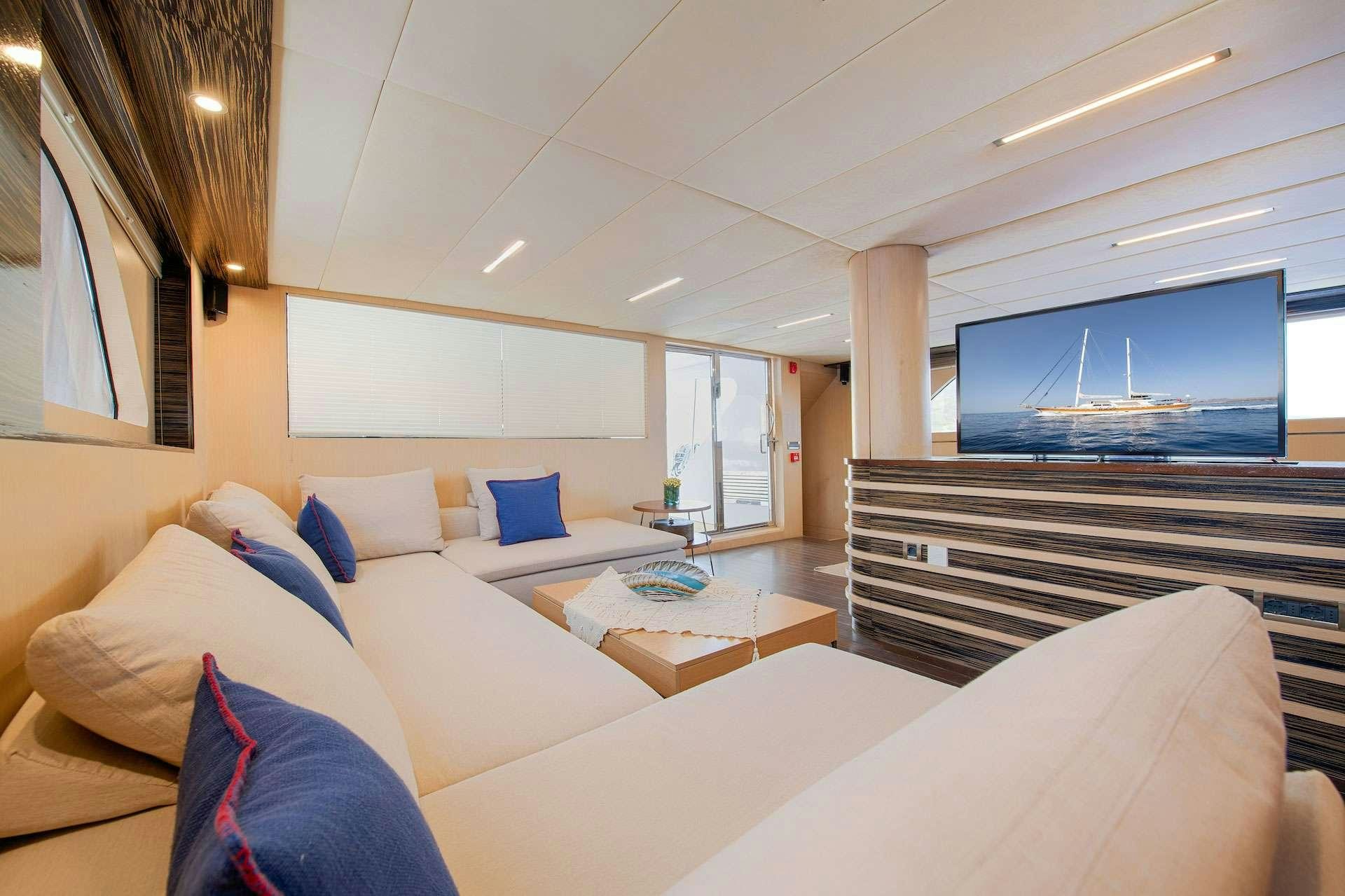 a room with a bed and a tv aboard THE WALL Yacht for Charter
