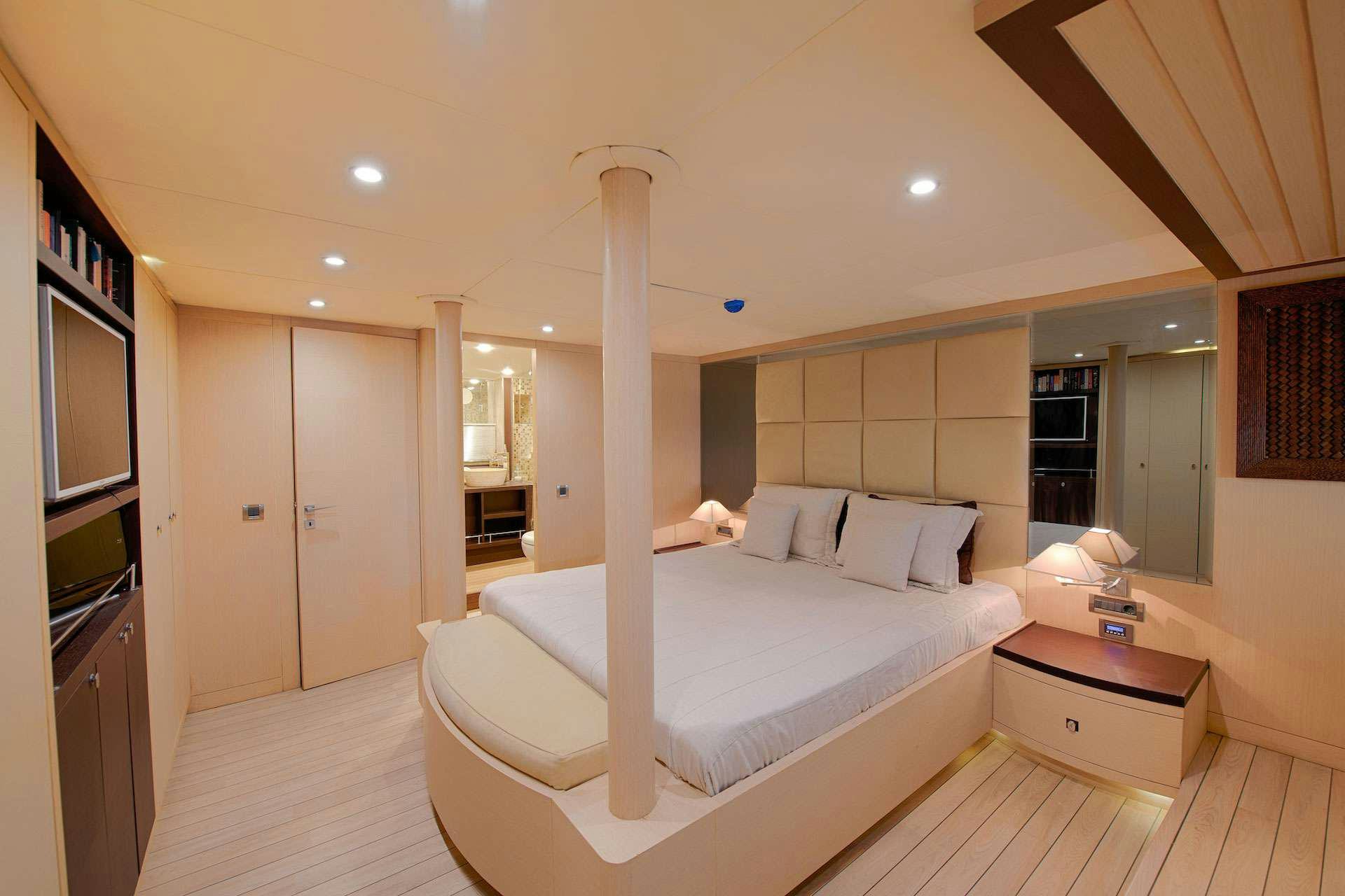 a large bedroom with a large bed aboard THE WALL Yacht for Charter