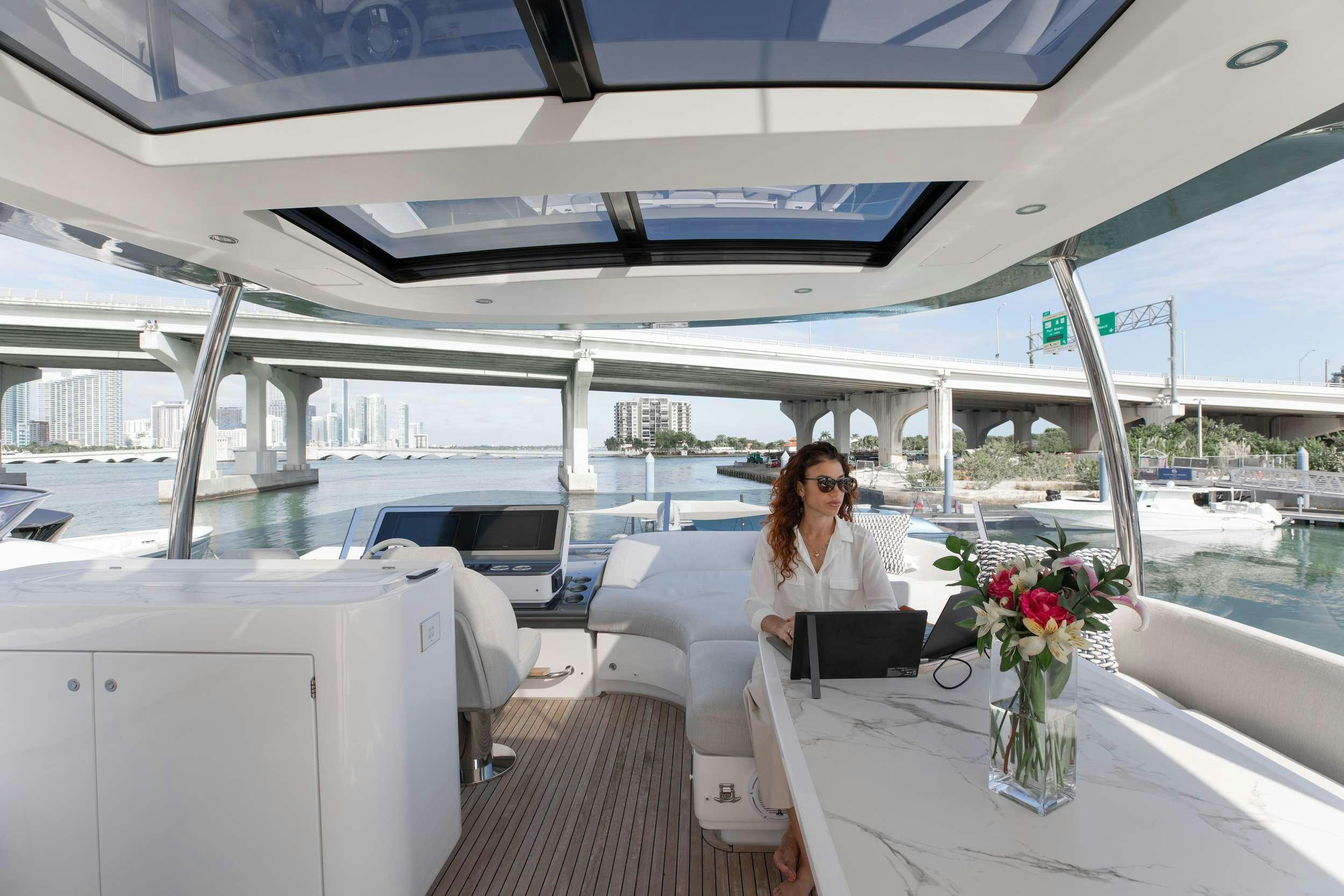 a person sitting in a boat aboard NENA Yacht for Charter