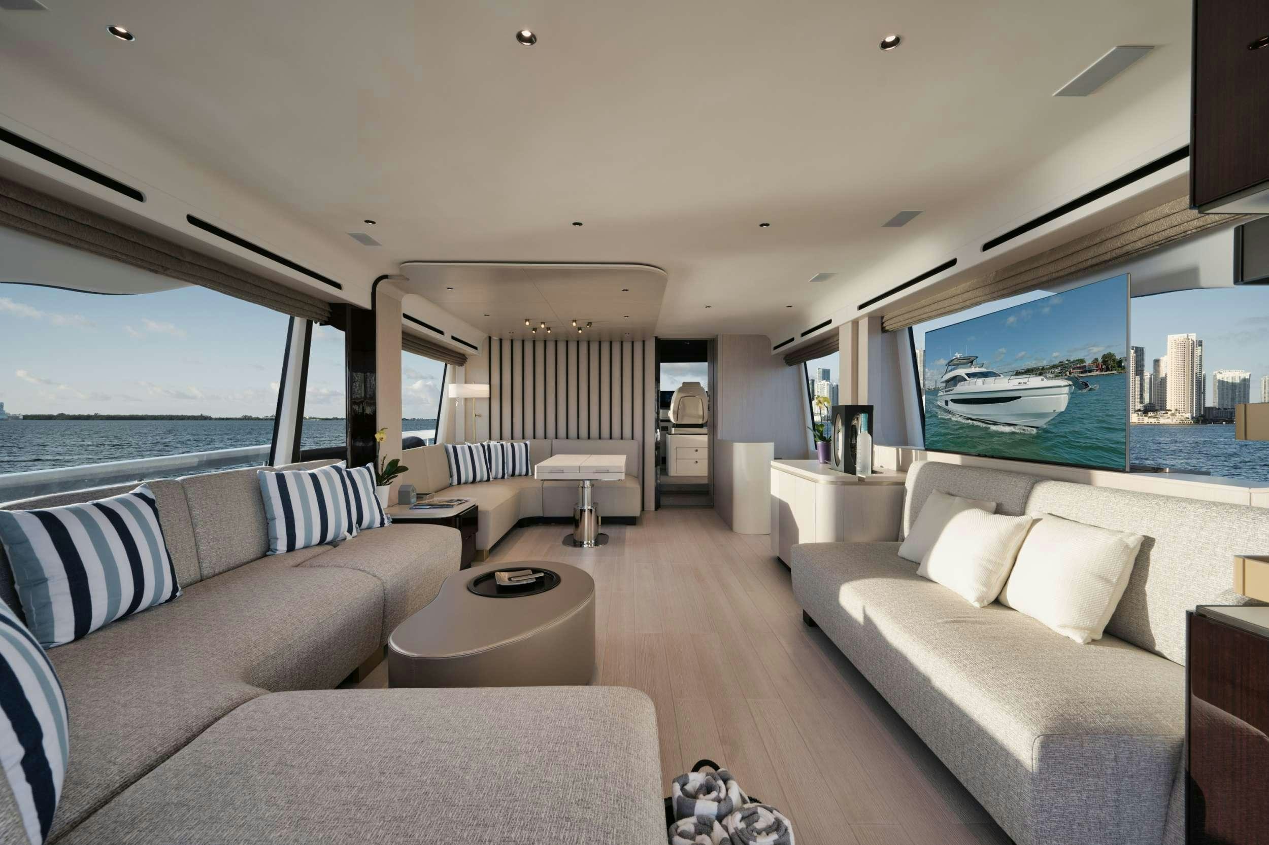 a living room with a large window aboard NENA Yacht for Charter