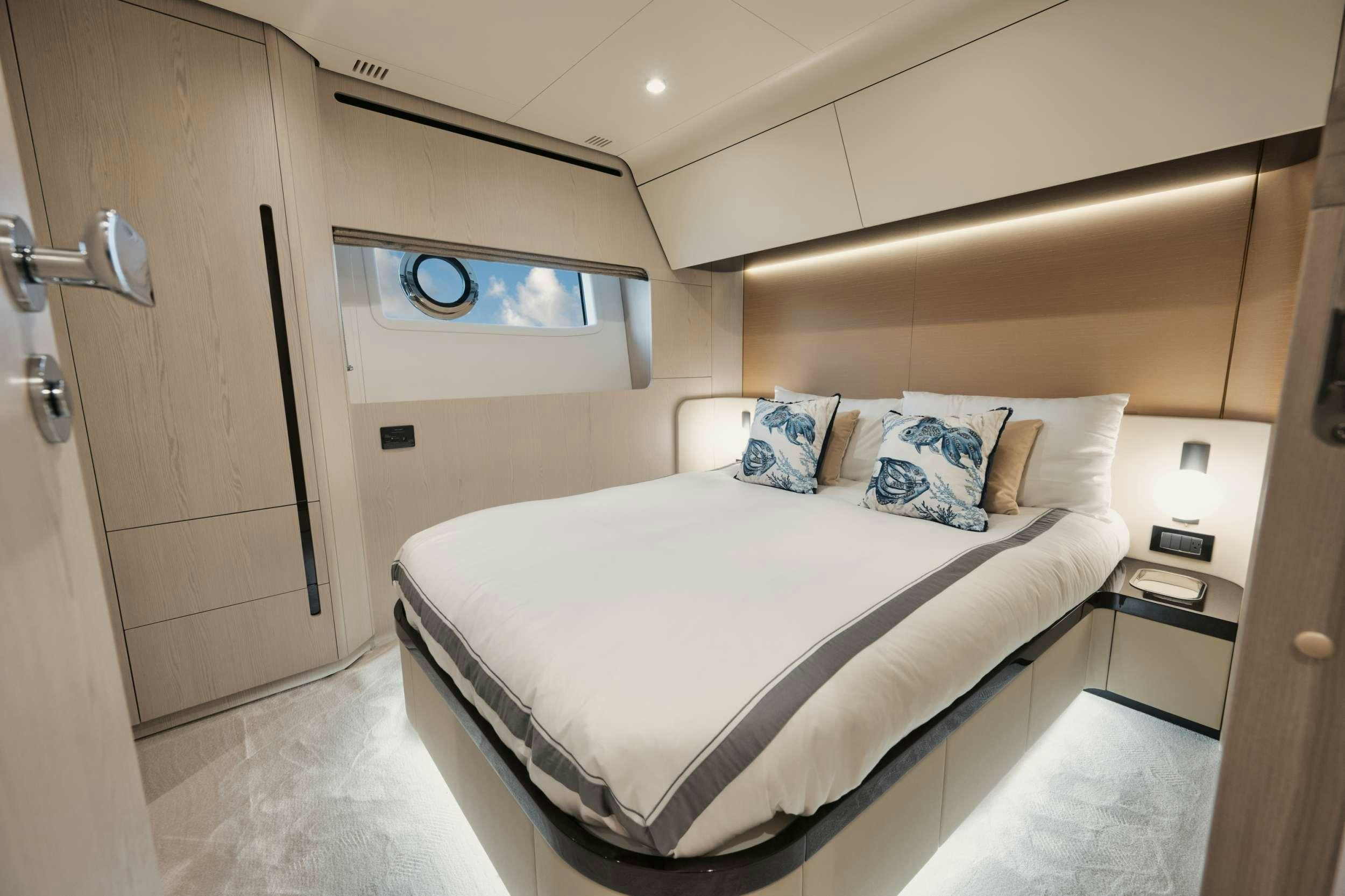 a bed in a room aboard NENA Yacht for Charter