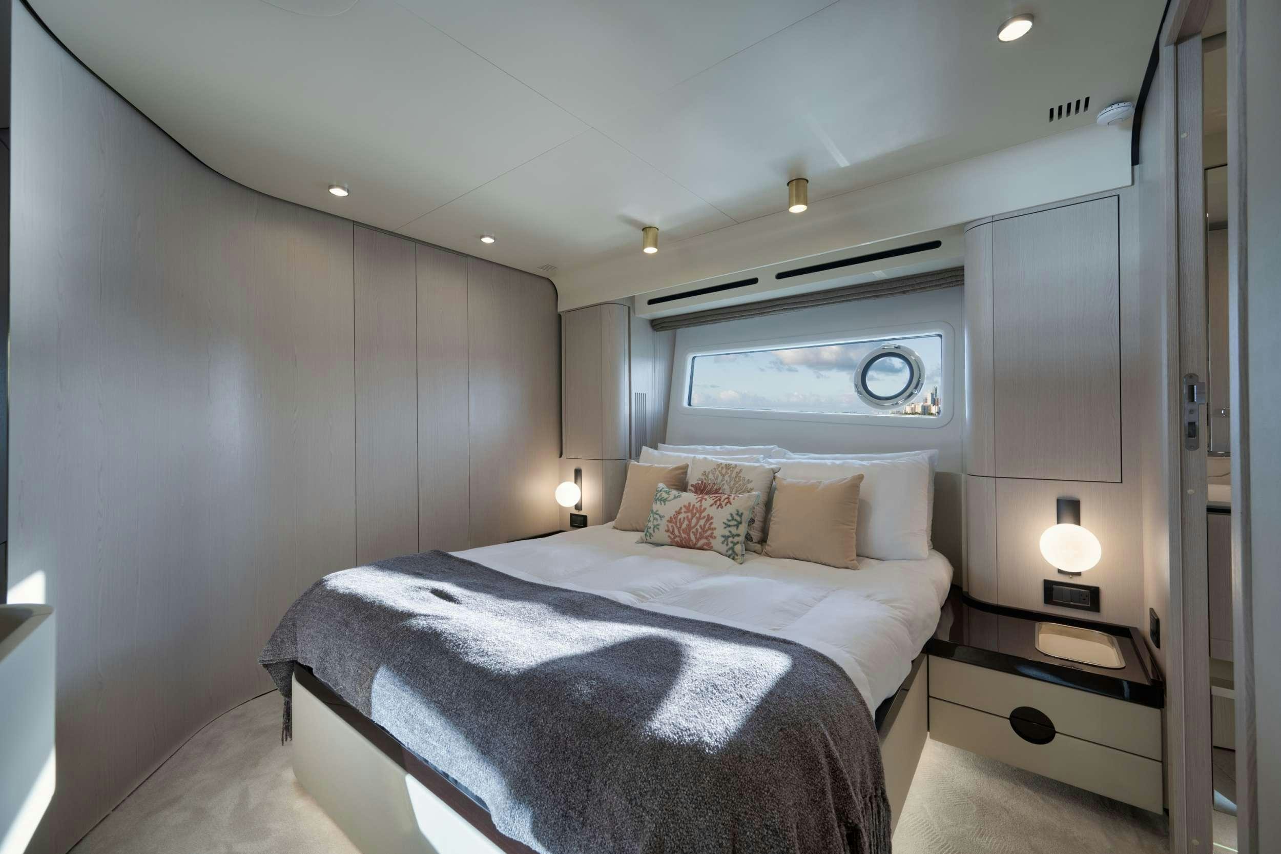 a bed in a room aboard NENA Yacht for Charter