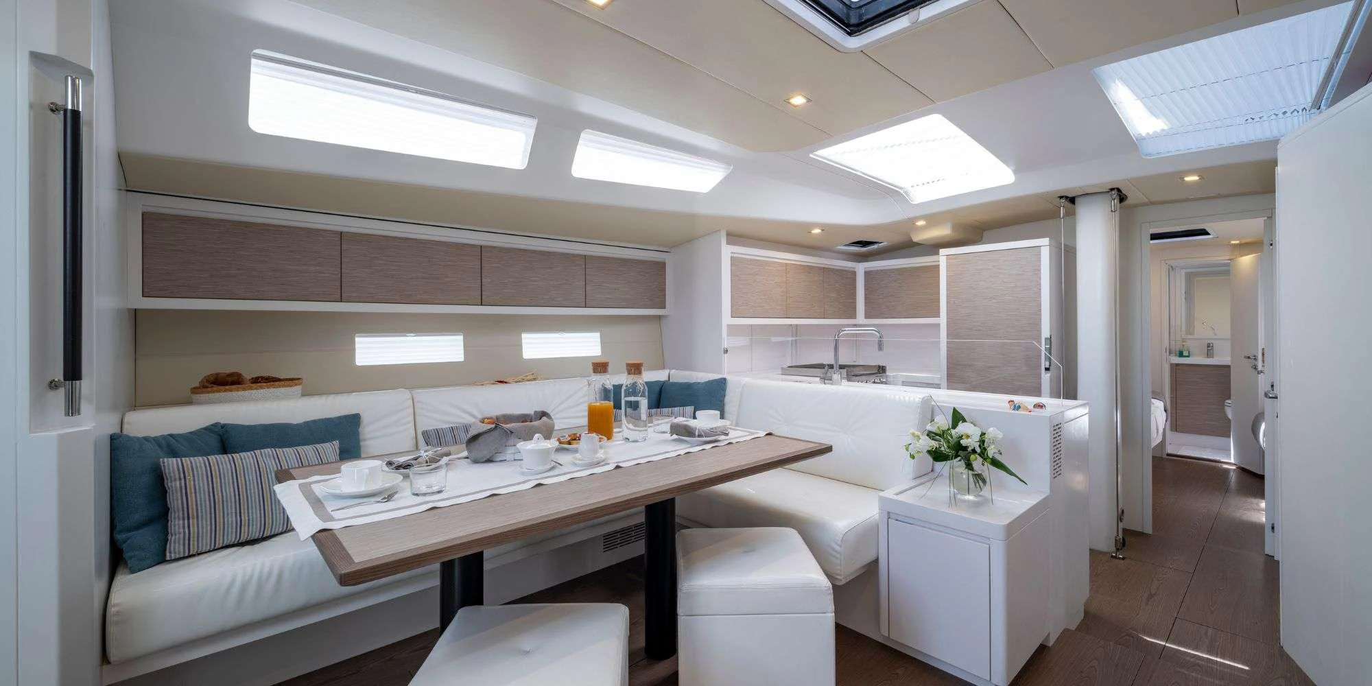 a room with a table and chairs aboard PURA FOLLIA Yacht for Charter