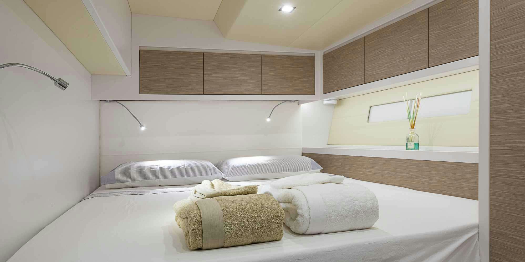 a couple of towels on a bed aboard PURA FOLLIA Yacht for Charter