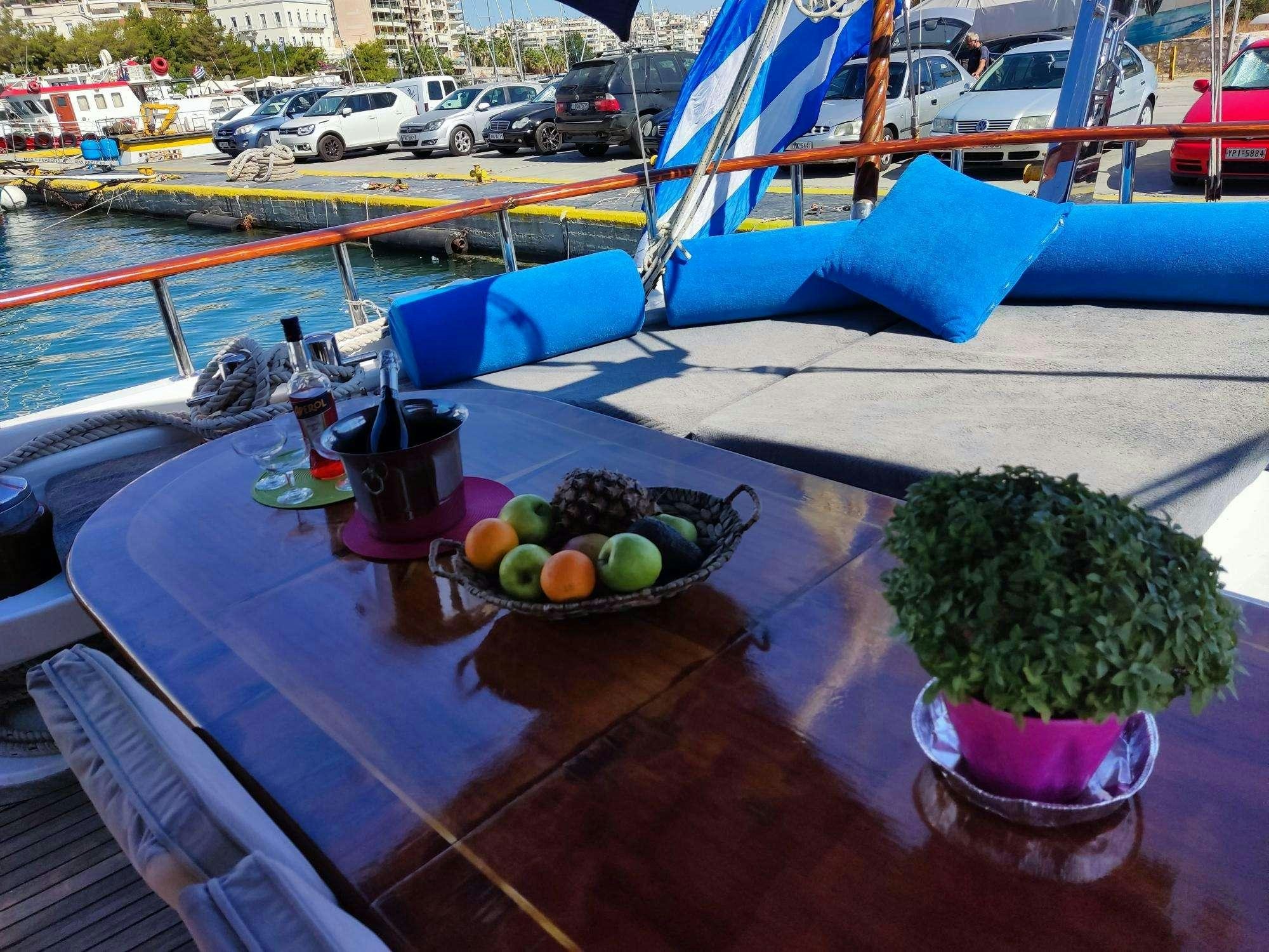a table with fruit on it aboard Stella Queen Yacht for Charter