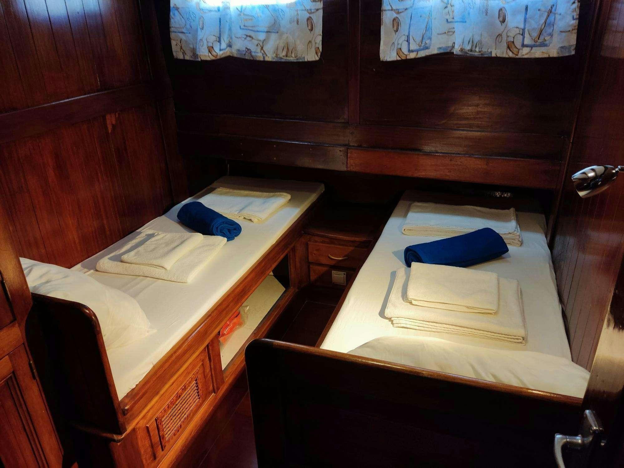 a desk with a book and a book on it aboard Stella Queen Yacht for Charter