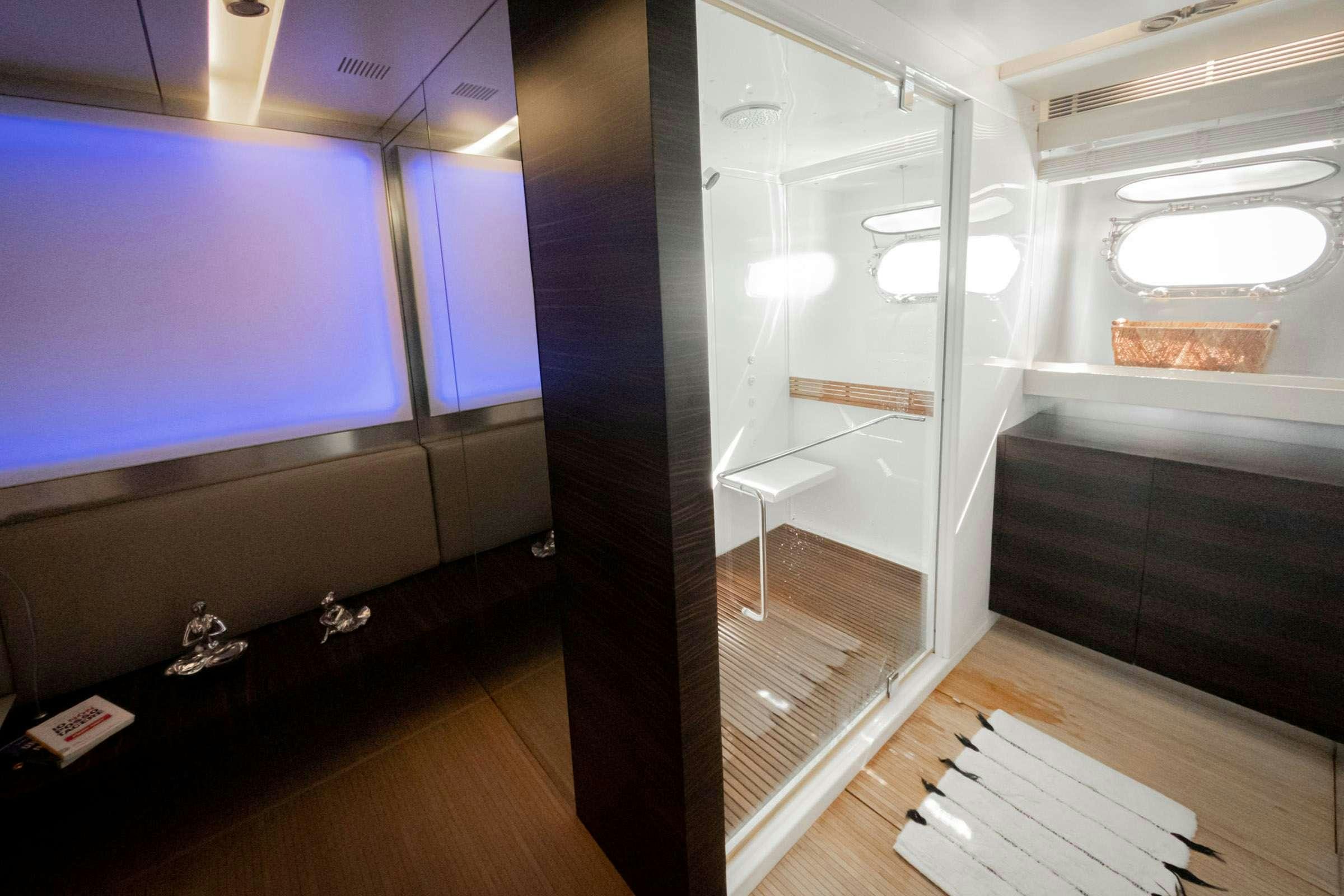 a room with a white bunk bed aboard CADA UNO  Yacht for Charter