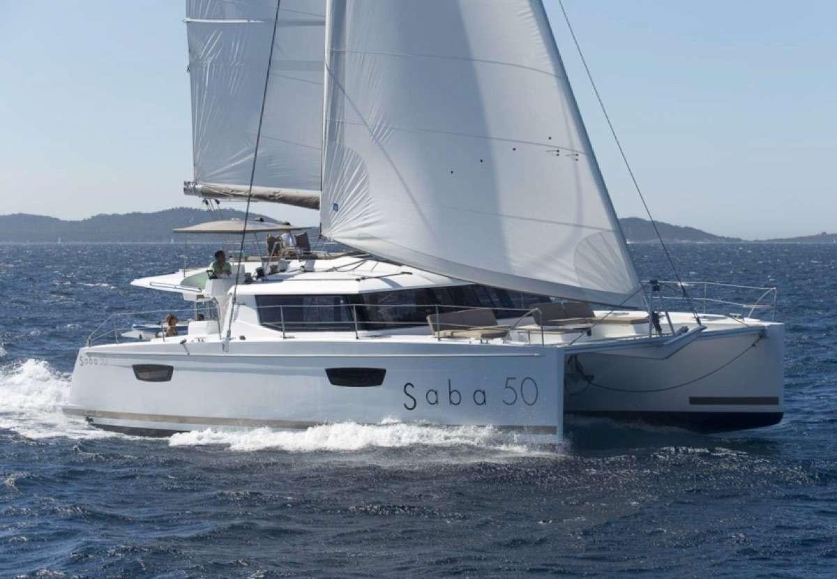 a white boat on the water aboard Daydreams Yacht for Charter