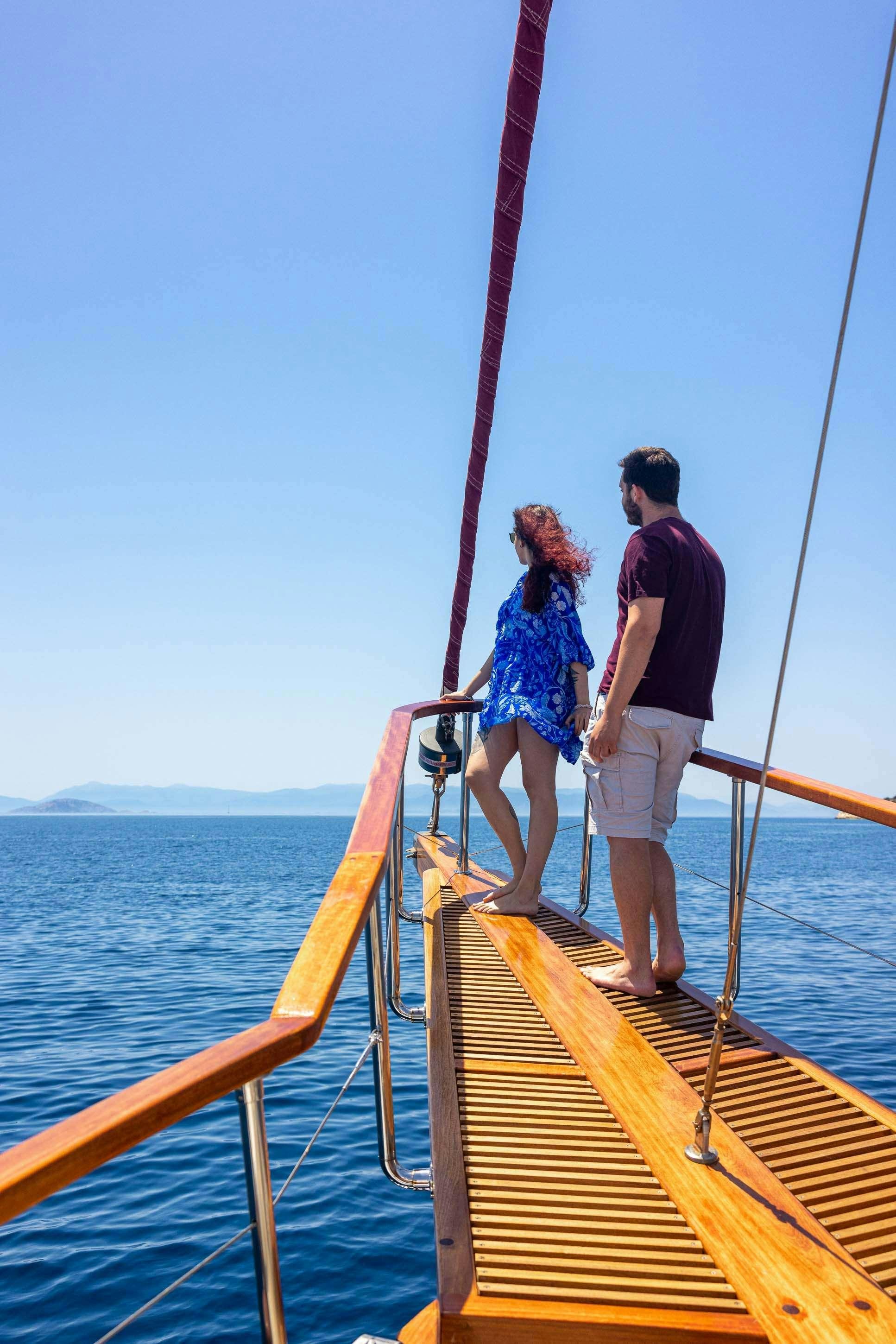 a man and a woman on a boat aboard MELTEMI Yacht for Charter
